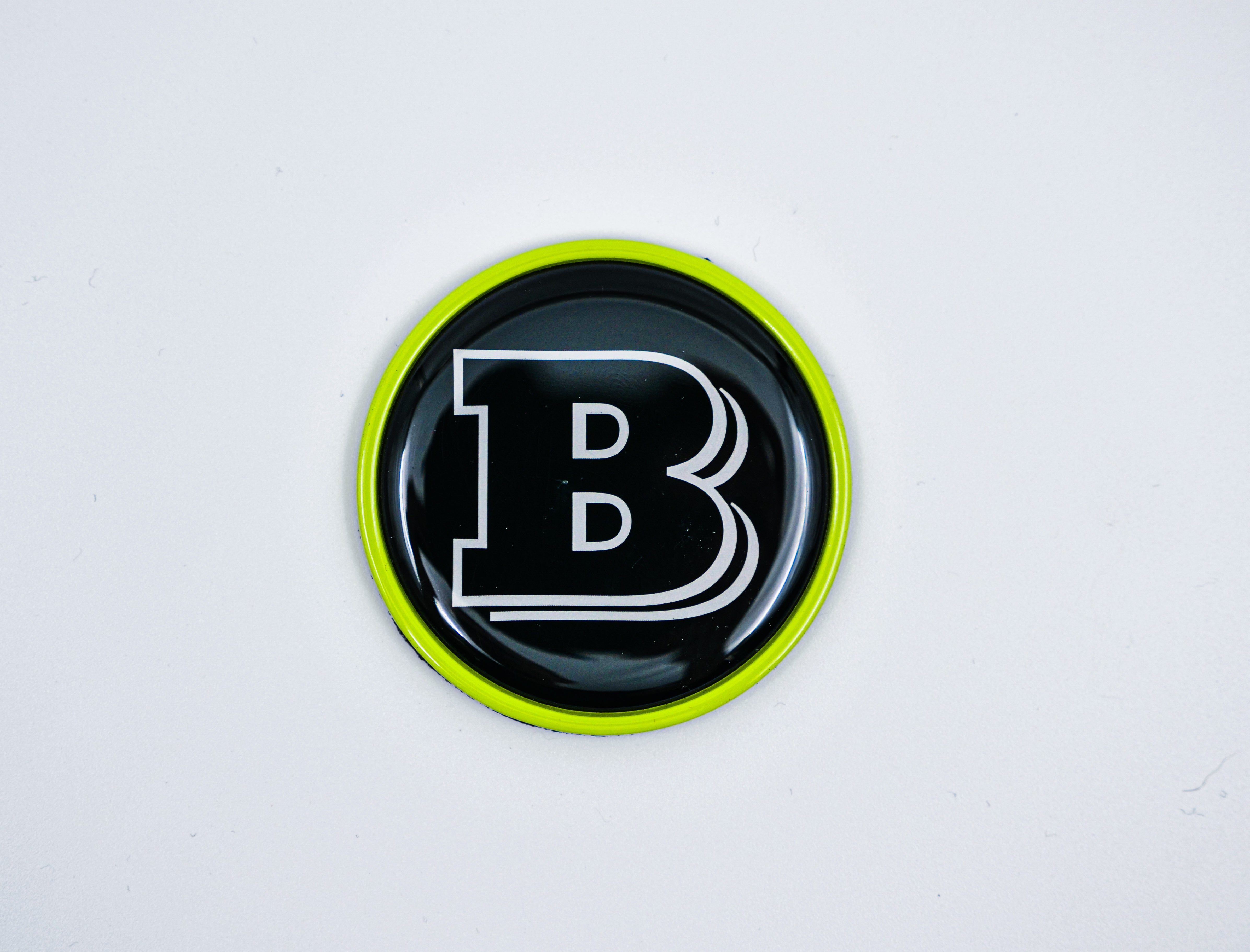 2-component metal lime green Brabus badge logo emblem 55mm for hood scoop of Mercedes-Benz W463, W463A, W464 G-Class - Custom Class