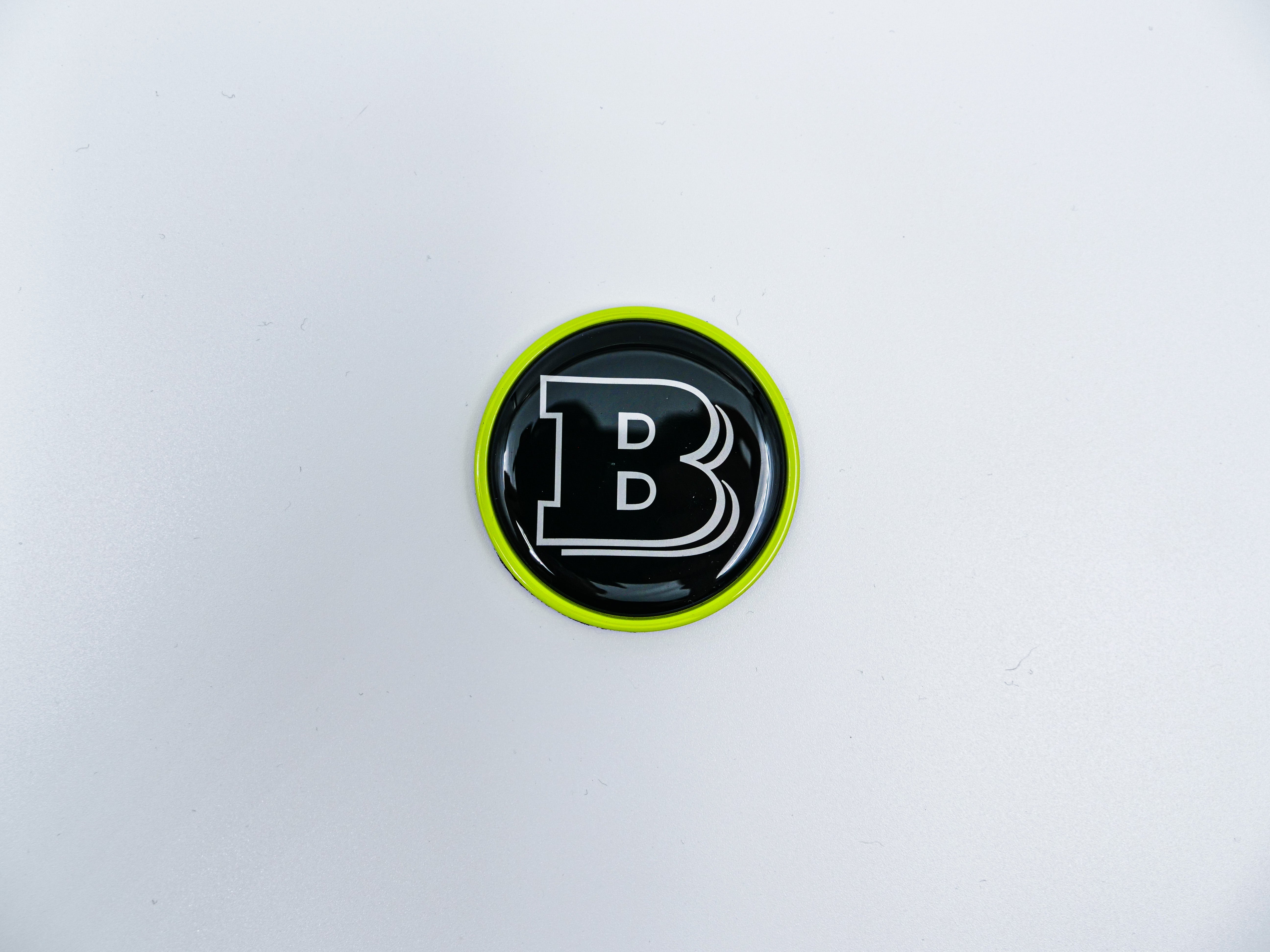 2-component metal lime green Brabus badge logo emblem 55mm for hood scoop of Mercedes-Benz W463, W463A, W464 G-Class.