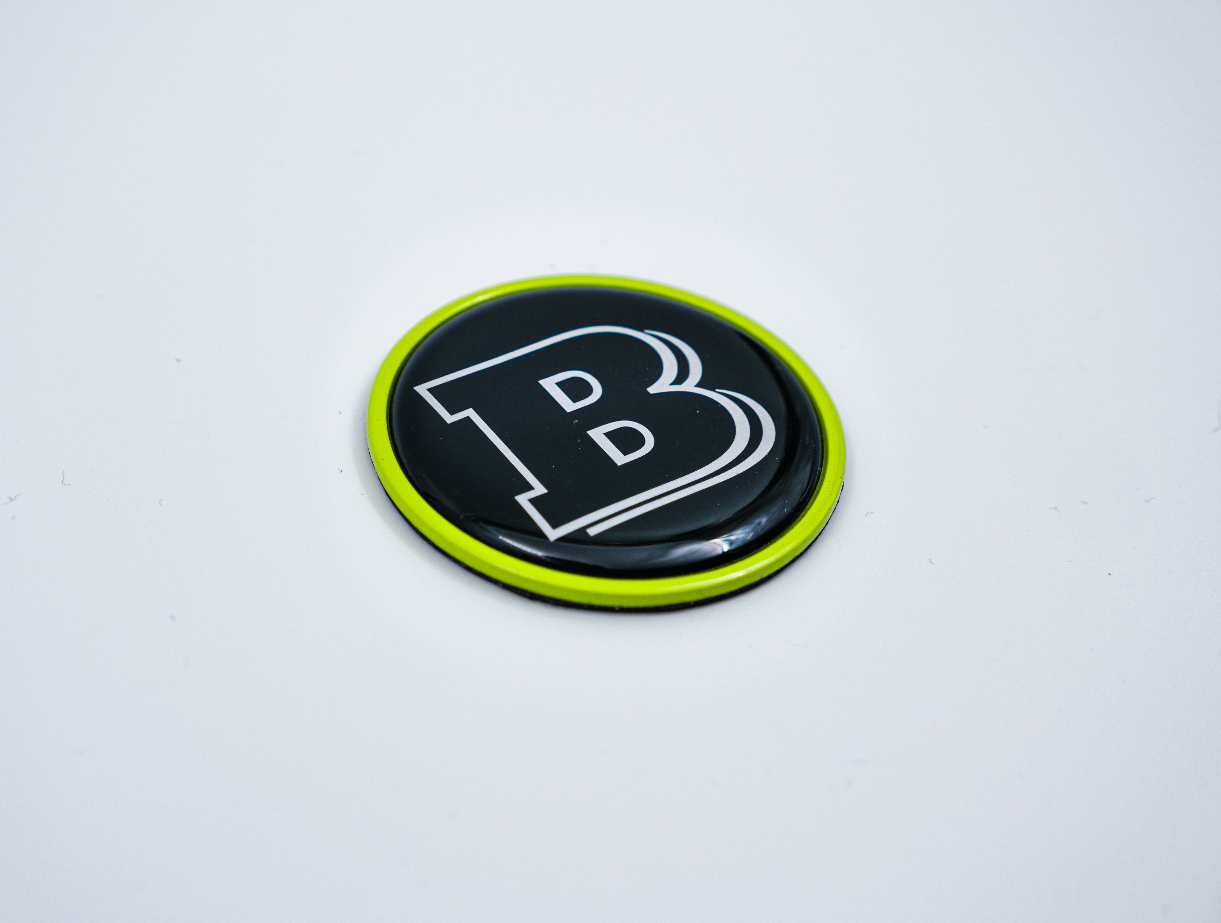 2-component metal lime green Brabus badge logo emblem 55mm for hood scoop of Mercedes-Benz W463, W463A, W464 G-Class - Custom Class