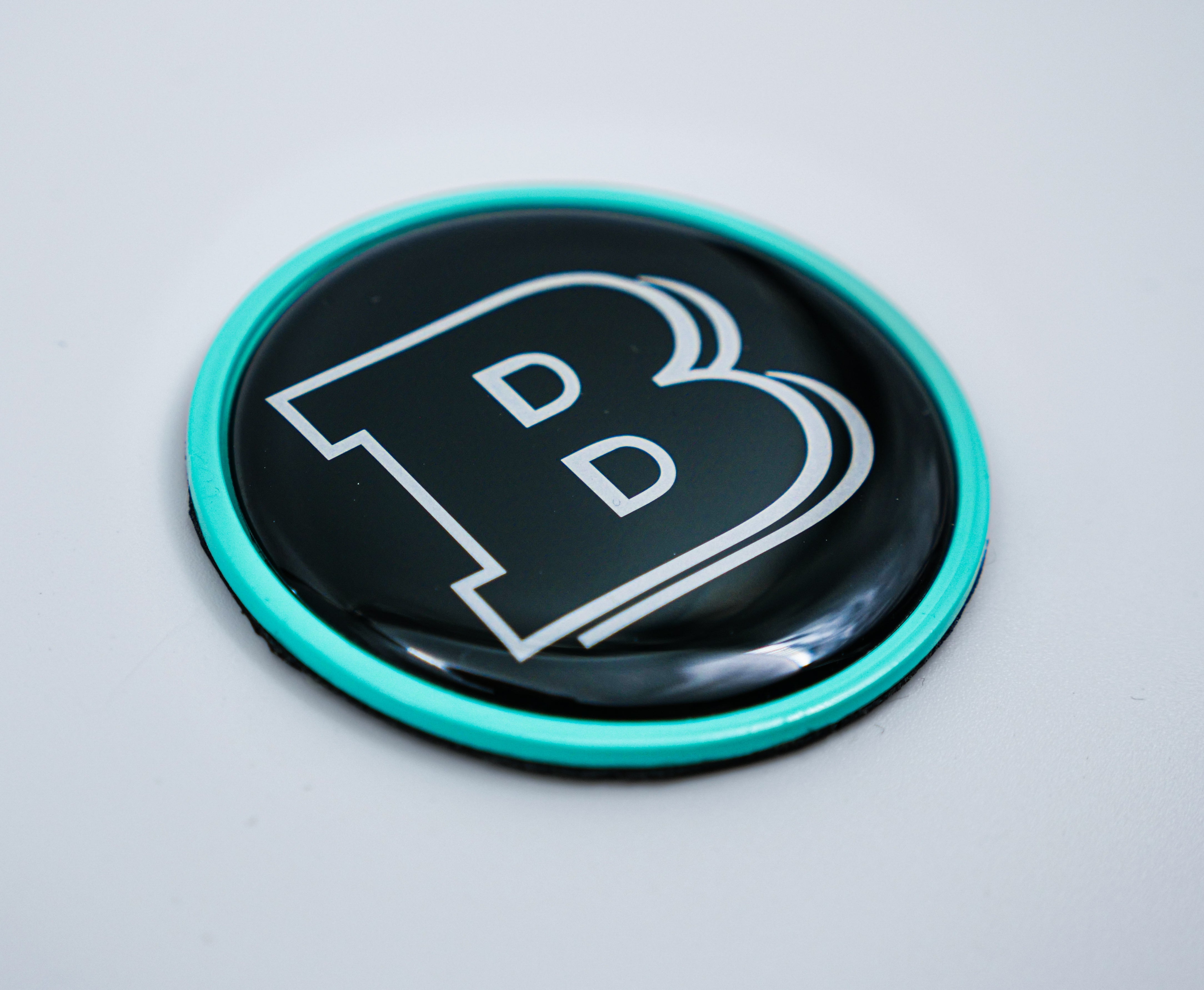 2-component metal Tiffany blue Brabus badge logo emblem 55mm for hood scoop of Mercedes-Benz W463, W463A, W464 G-Class - Custom Class