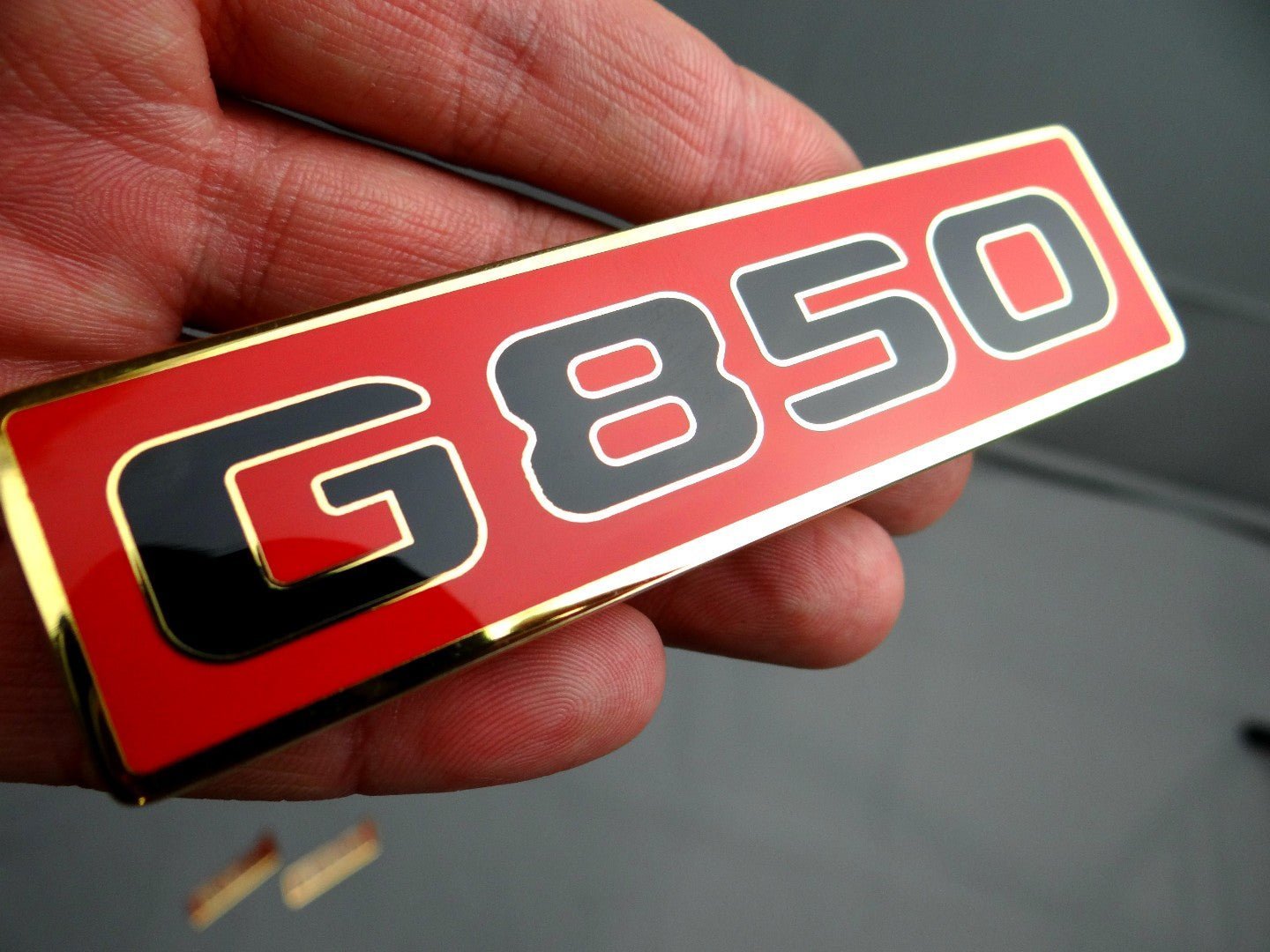 850 Front Grille Red Logo Badge Emblem for Mercedes Benz G-Wagon G-Class W463 from Custom Class, made of high-quality stainless steel.