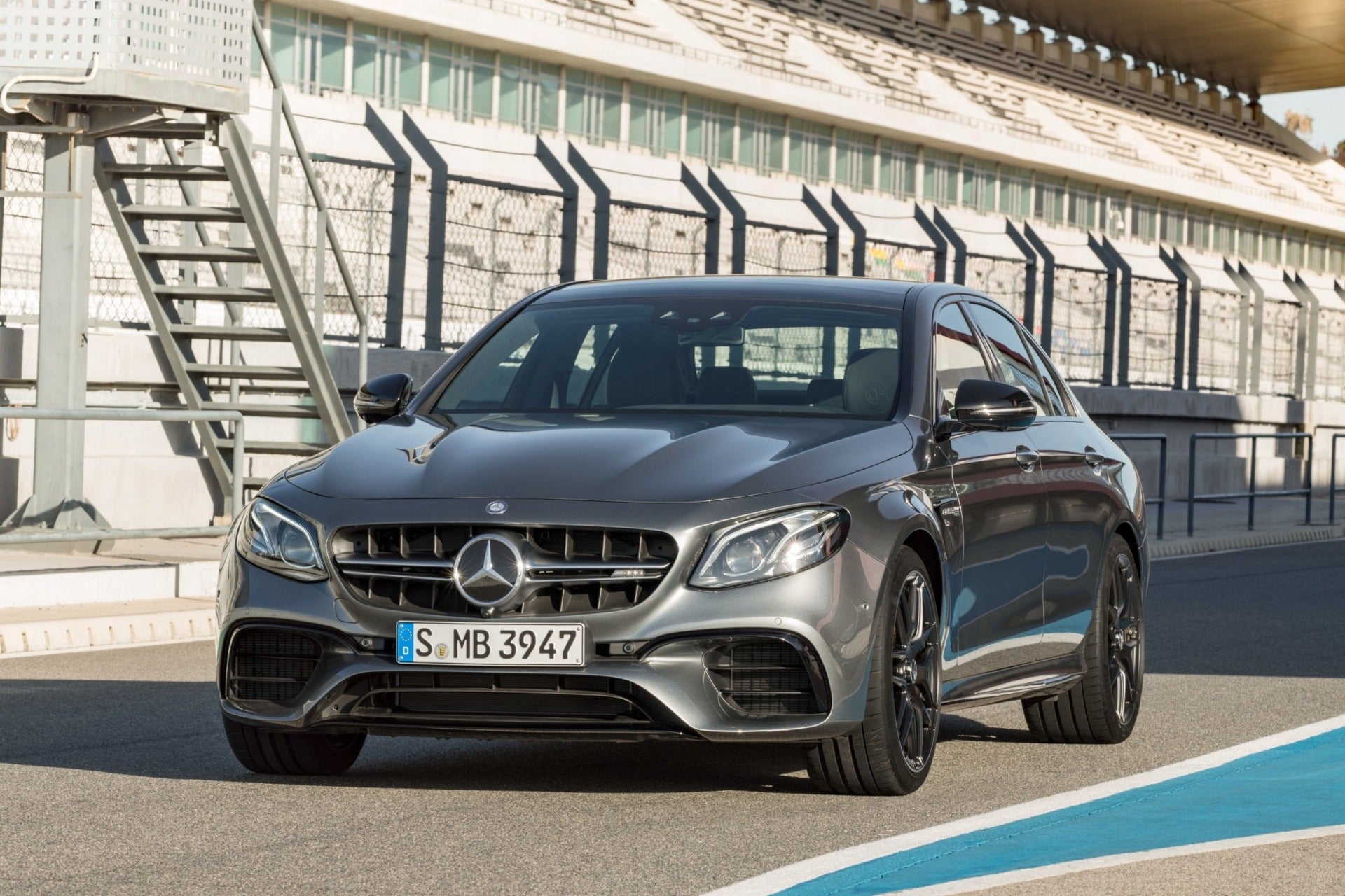 AMG E63 style bodykit for Mercedes E-Class W213 (2016+), complete with front bumper, diffuser, grille, exhaust tips, and mounting components.