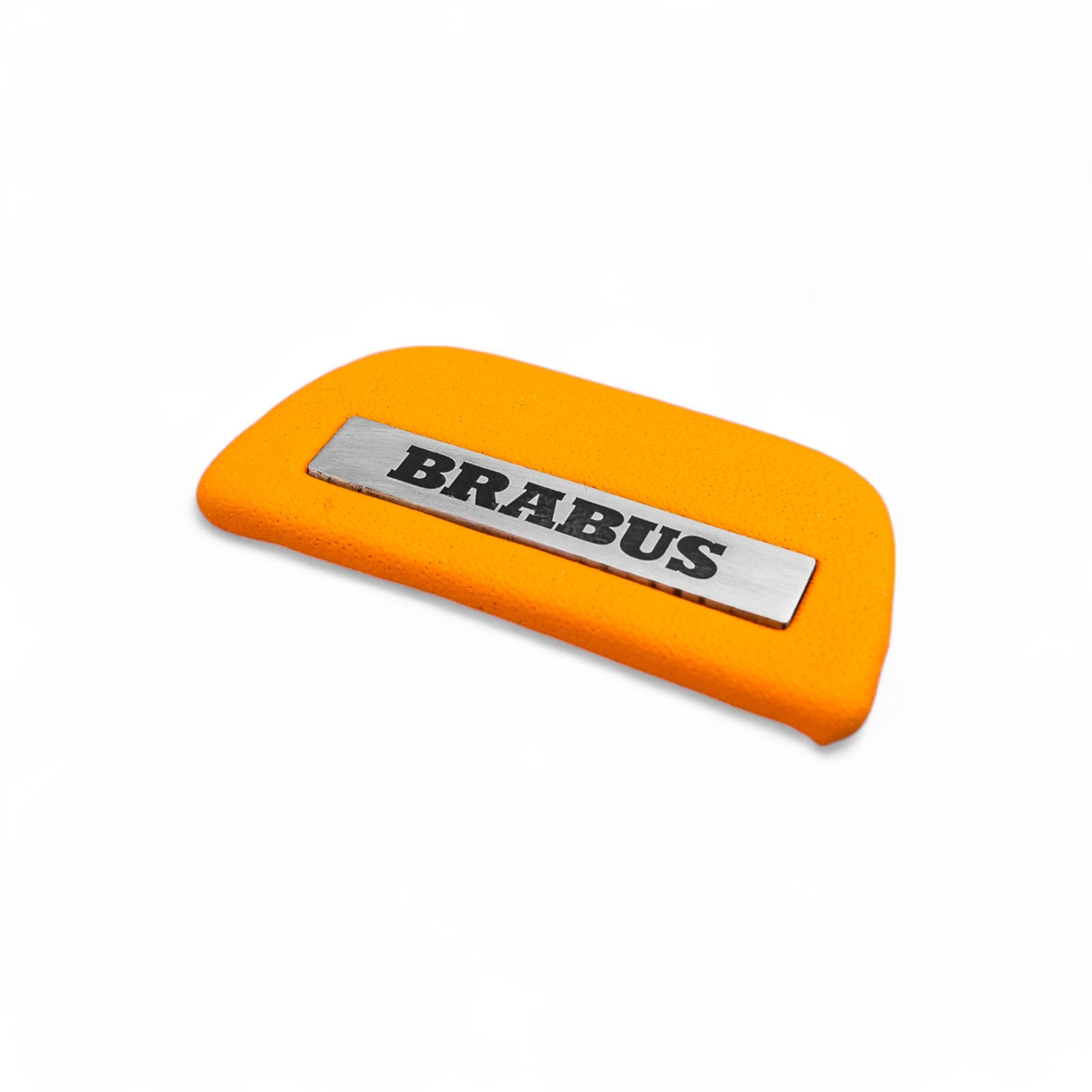 Brabus orange leather emblem insert for AMG steering wheel on Mercedes-Benz W463A W464 from Custom Class, crafted in high-quality orange leather.