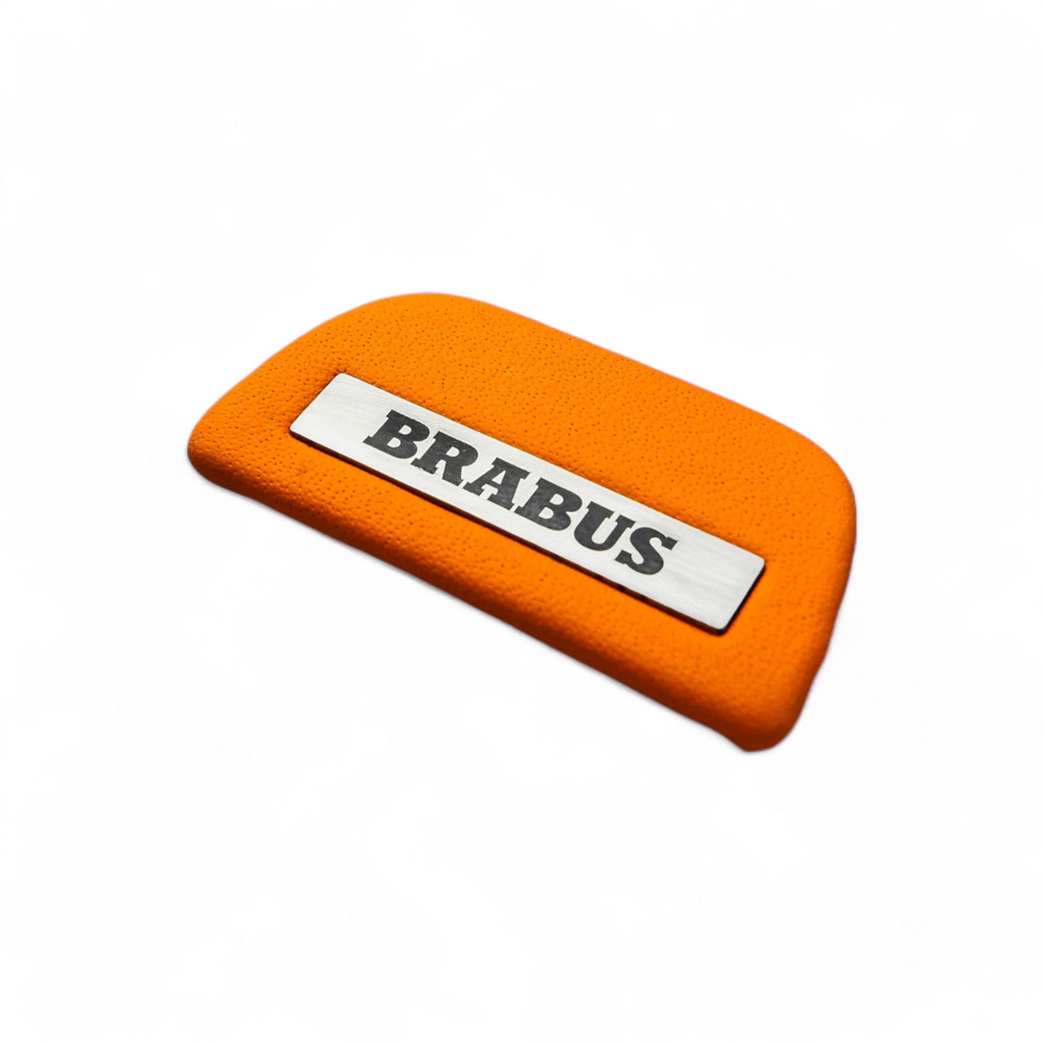 Brabus orange leather emblem insert for AMG steering wheel on Mercedes-Benz W463A W464 from Custom Class, crafted in high-quality orange leather.