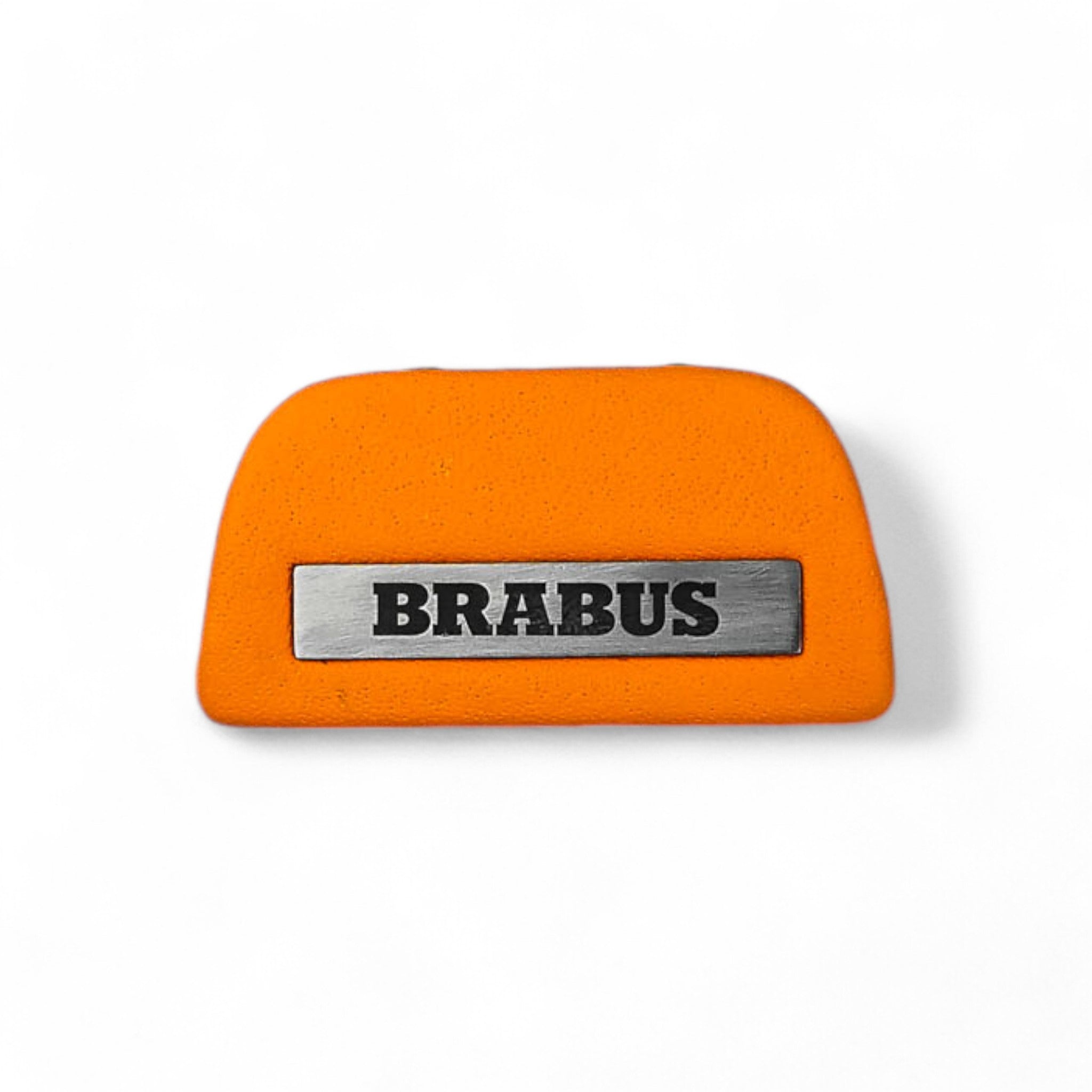 Brabus orange leather emblem insert for AMG steering wheel on Mercedes-Benz W463A W464 from Custom Class, crafted in high-quality orange leather.