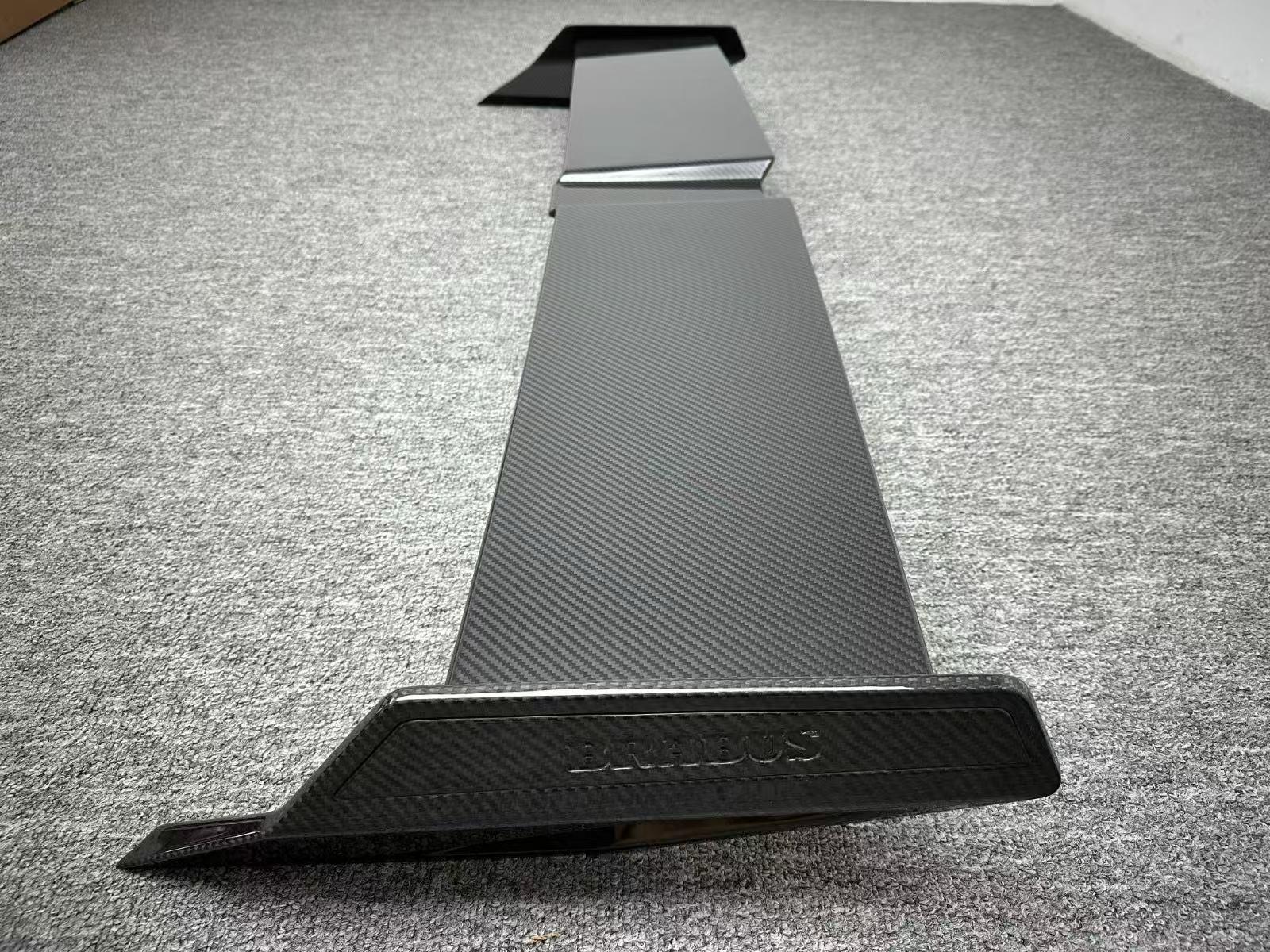 Brabus rear roof spoiler for Mercedes-Benz G-Class W465 2024+, premium carbon fiber finish, available in glossy or matte.