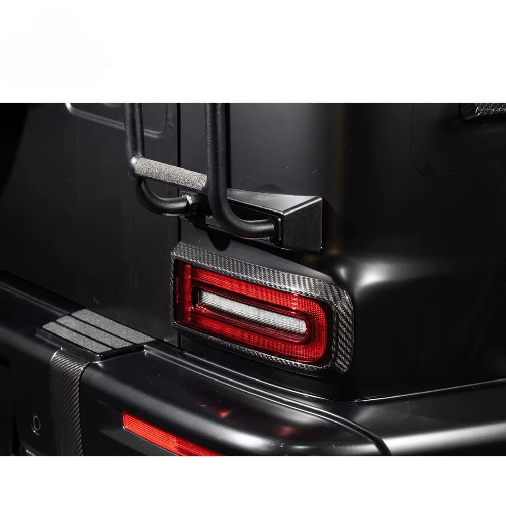 Car tail light with carbon fiber finish on a black vehicle