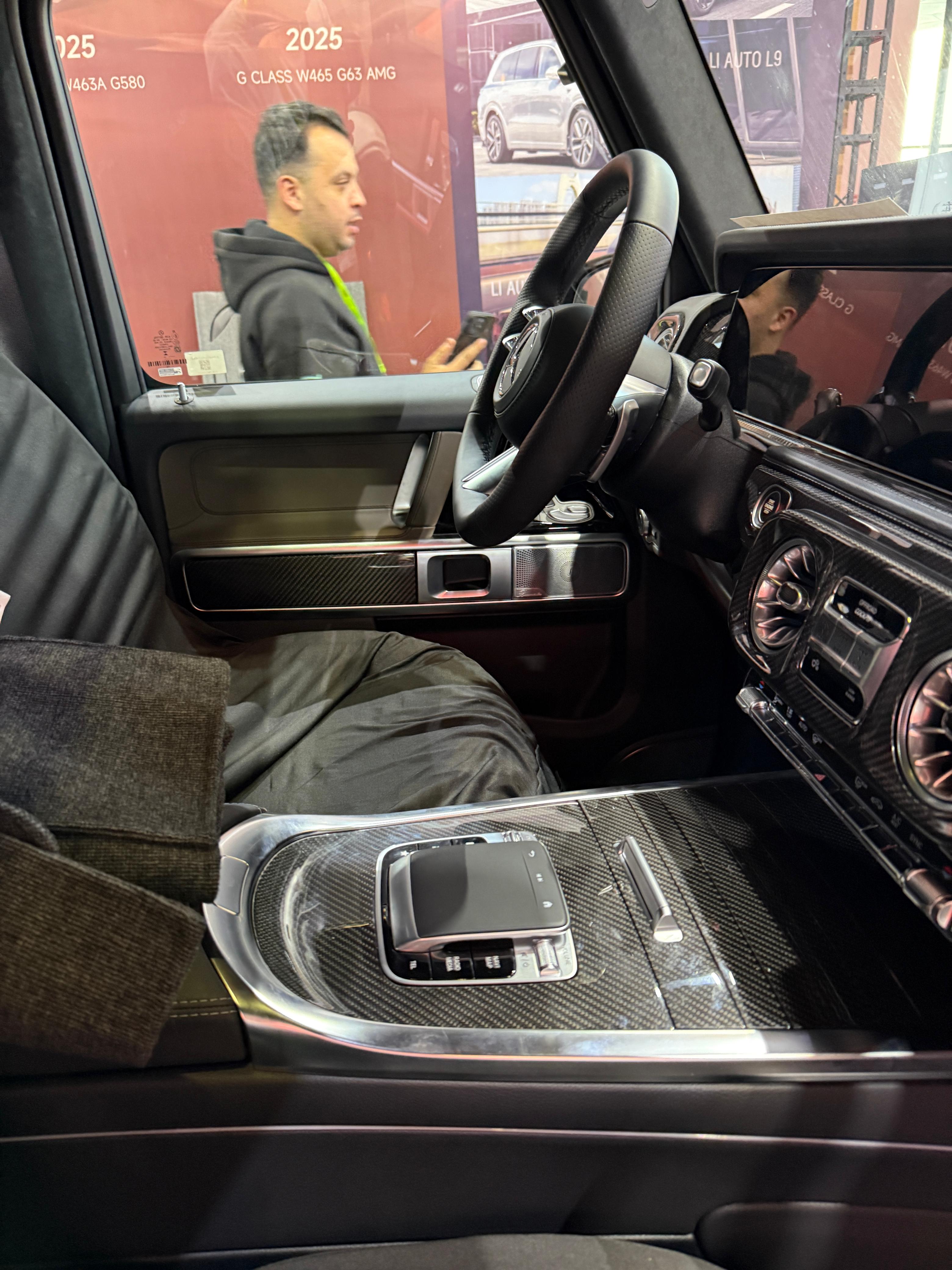 Carbon fiber interior trims for Mercedes G-Class W465 2024+ from Custom Class, featuring a sleek, glossy finish and premium fitment.