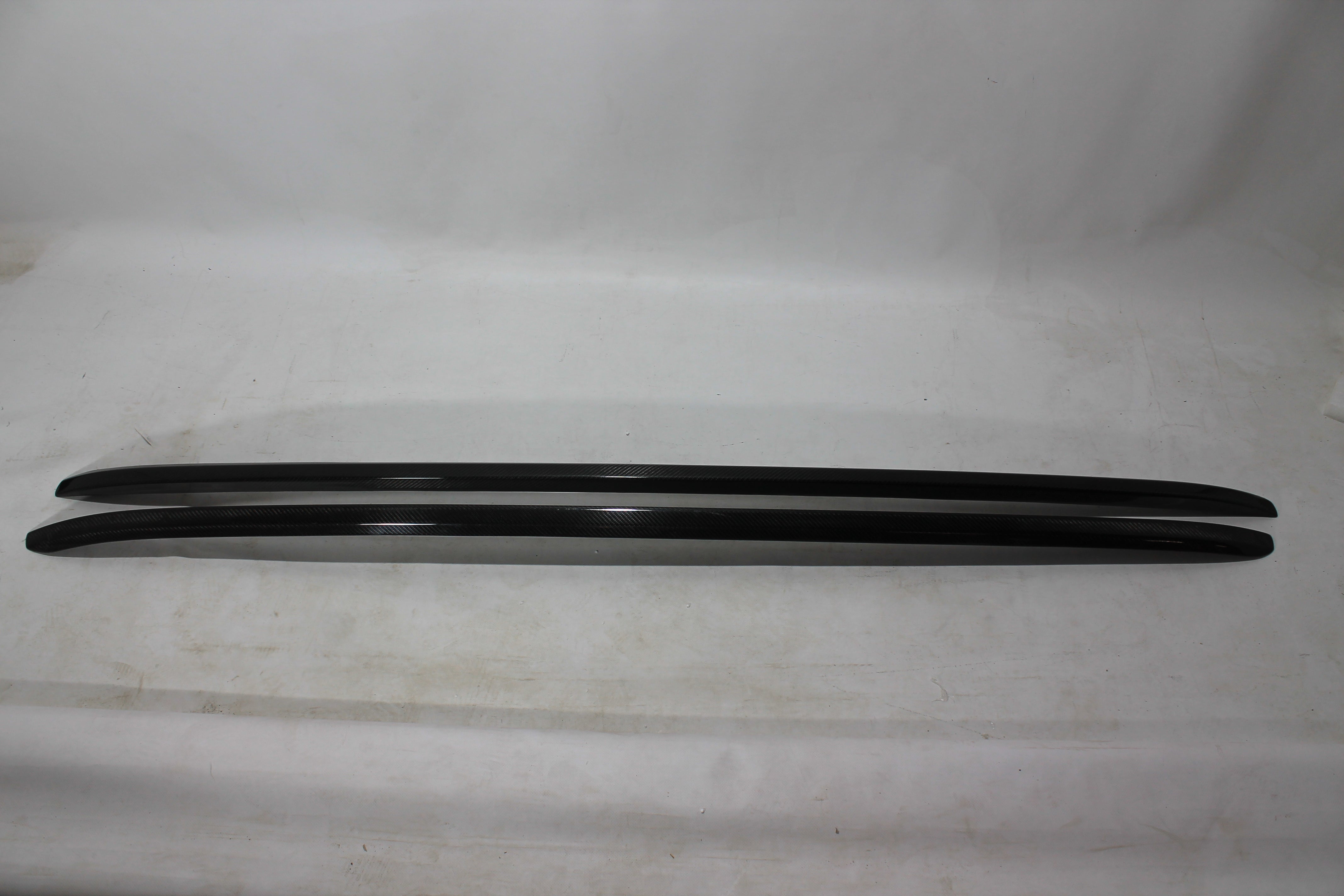 Carbon handrail (top trim) roof rails for Bentley Bentayga 2015-2018 from Custom Class, featuring genuine carbon fiber with a grey gloss UV-resistant finish.