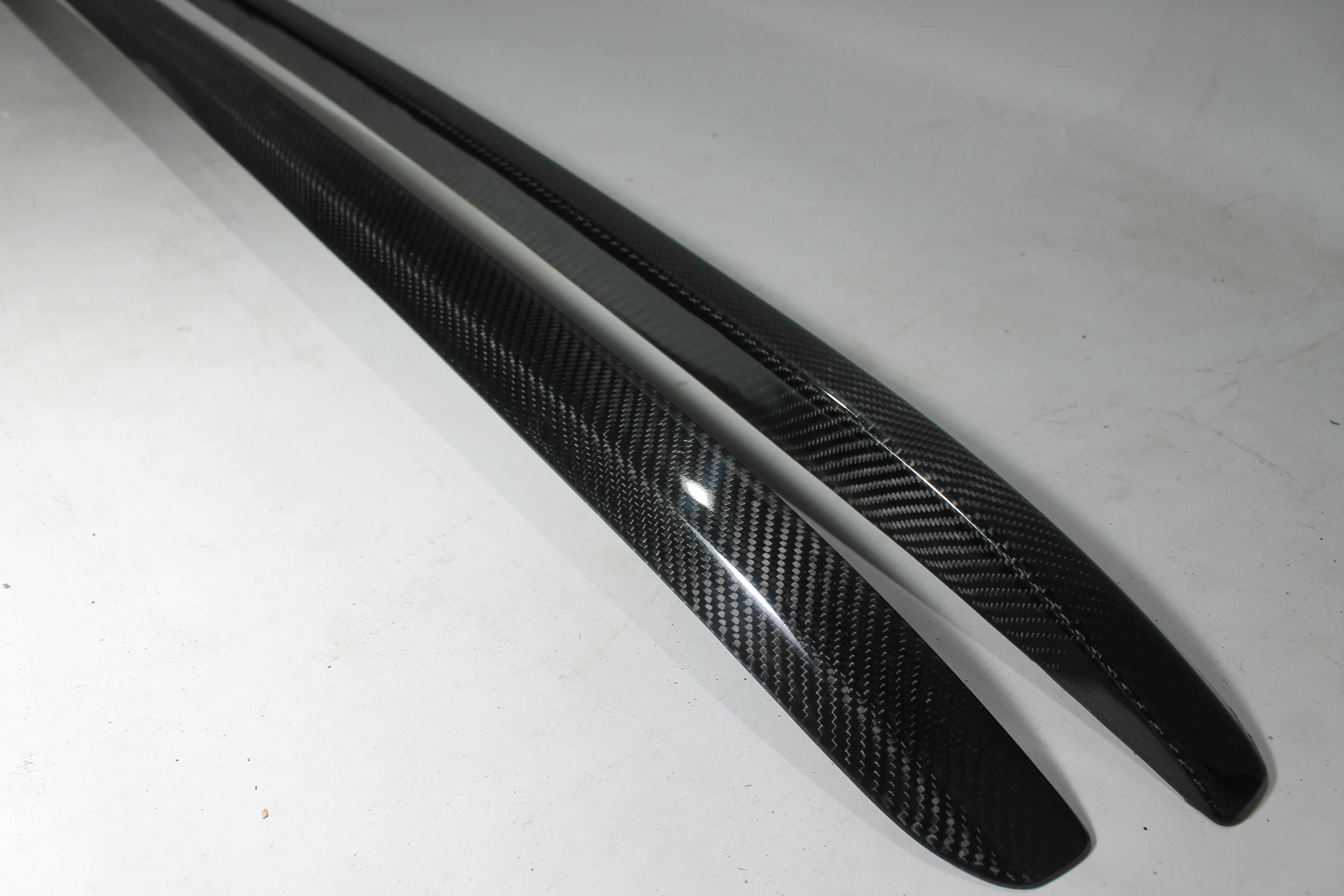 Carbon handrail (top trim) roof rails for Bentley Bentayga 2015-2018 from Custom Class, featuring genuine carbon fiber with a grey gloss UV-resistant finish.