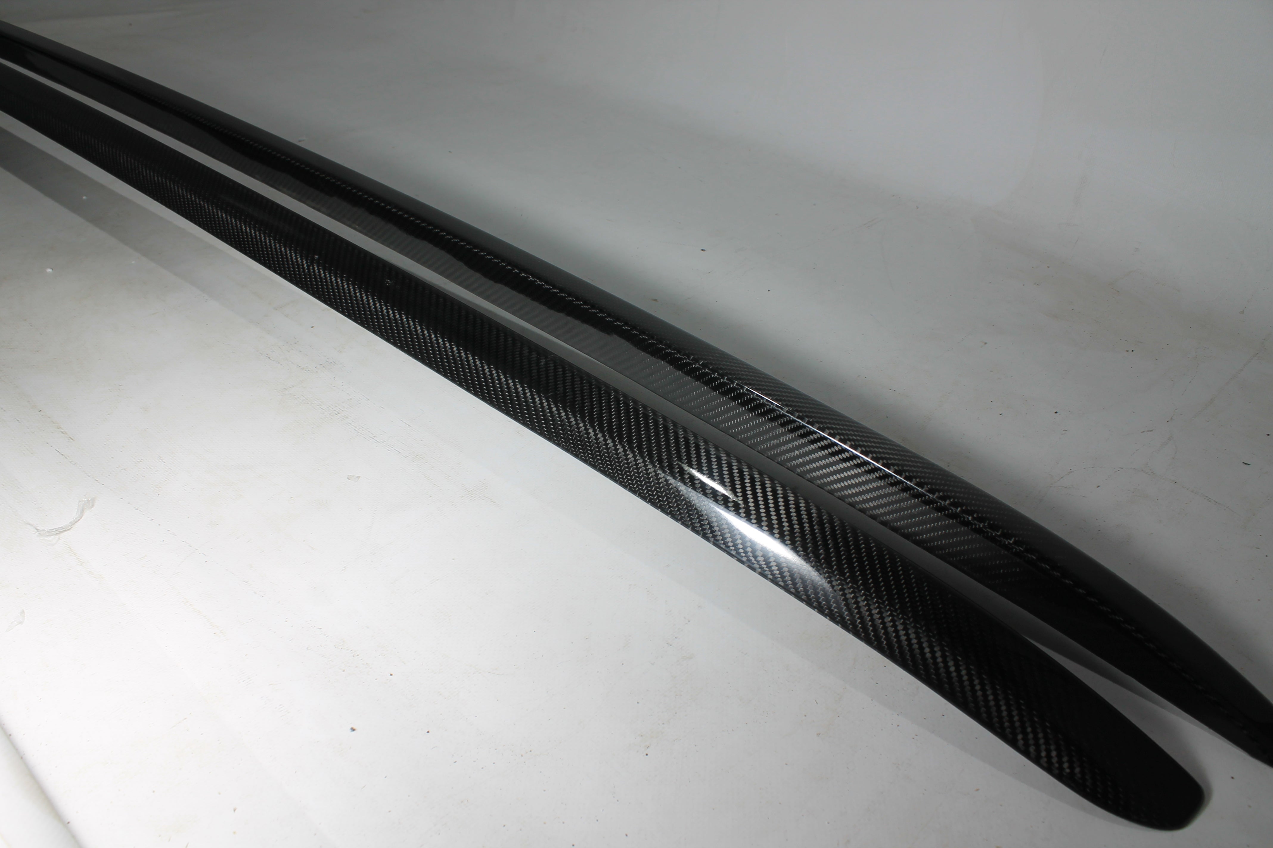 Carbon handrail (top trim) roof rails for Bentley Bentayga 2015-2018 from Custom Class, featuring genuine carbon fiber with a grey gloss UV-resistant finish.