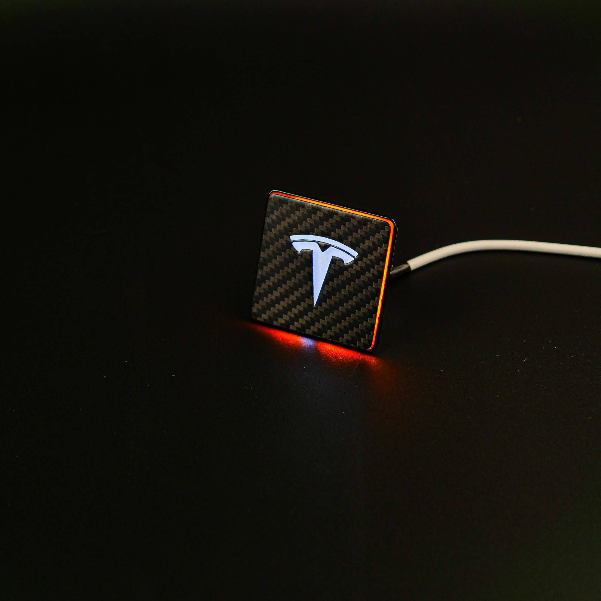 Carbon seat emblems with LED illumination for Tesla Model S, 3, X, Y, and Cybertruck - Custom Class