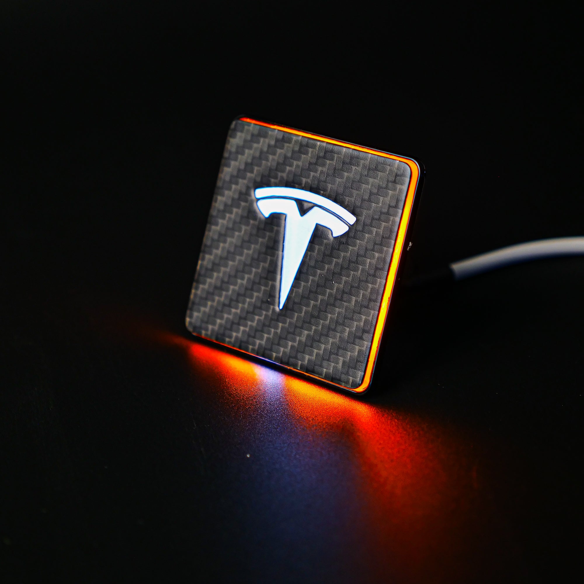 Carbon seat emblems with LED illumination for Tesla Model S, 3, X, Y, and Cybertruck - Custom Class