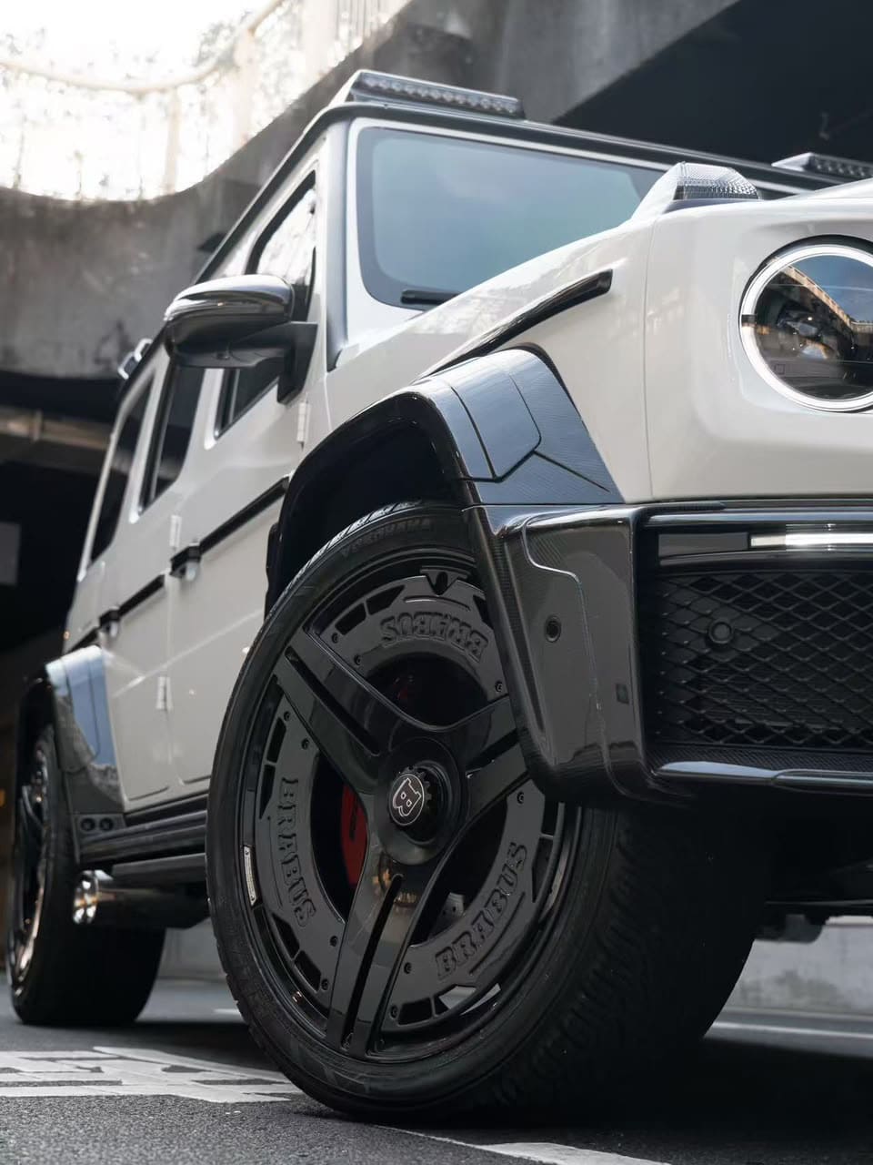 Direct side wheel shot showing high-performance brake caliper visible through the custom Monoblock wheel slots.