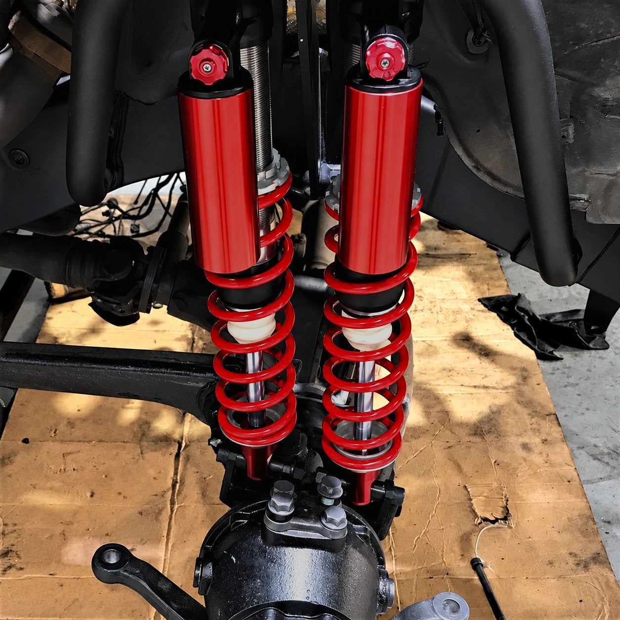 Red remote reservoir coilover shock absorbers included in the Custom Class dual shock kit for W463 G-Class.