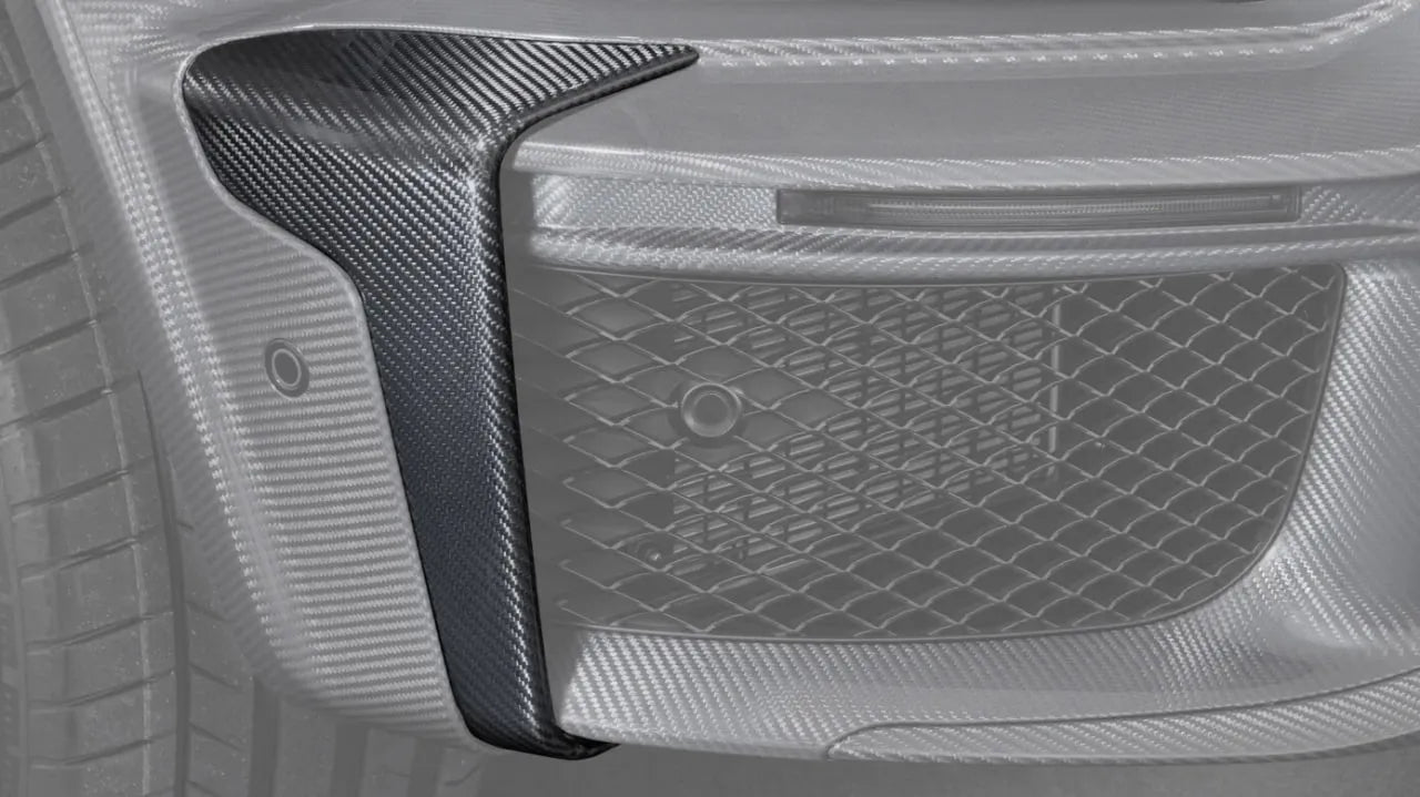 Installed view of Custom Class Widestar carbon bumper inserts with red accents on G-Class W465.