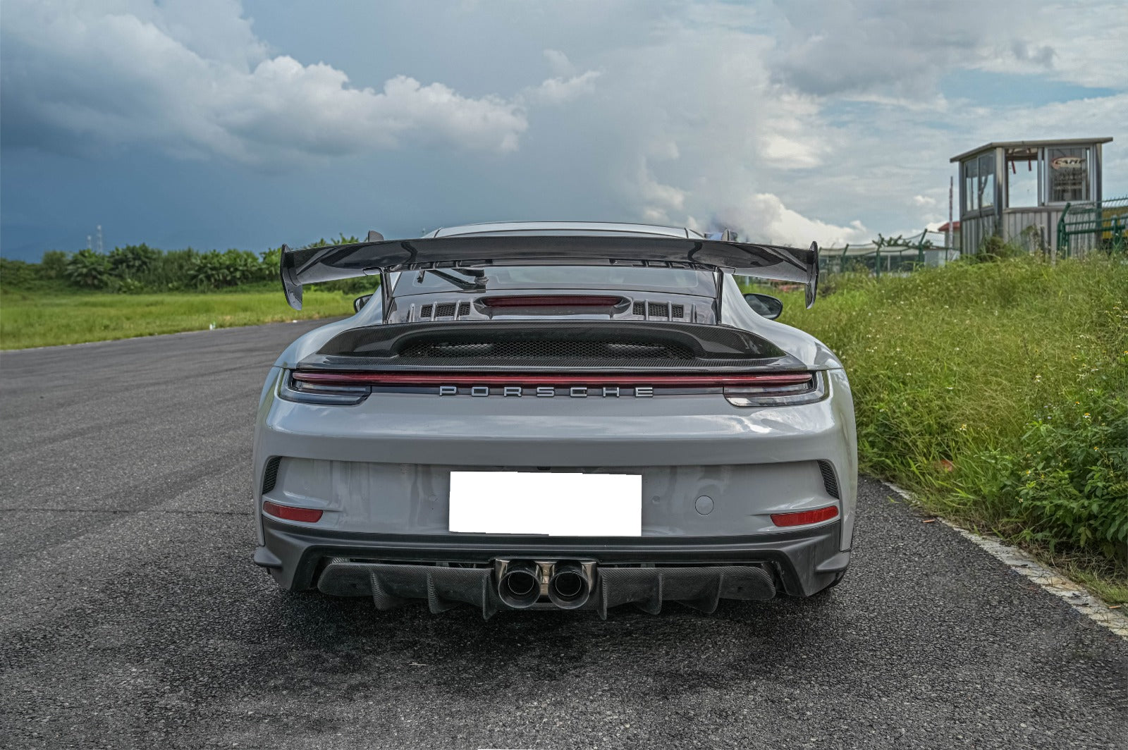 GT3 body kit rear view for Porsche 911 992 with large GT3 wing and carbon fiber diffuser