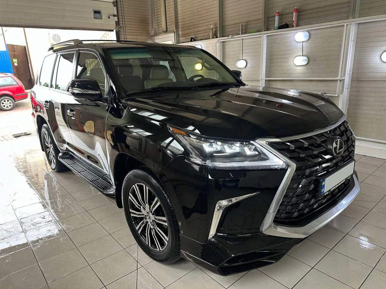 Rear bumper assembly with TRD Superior SPORT aerodynamic rear lip valance for Lexus LX570