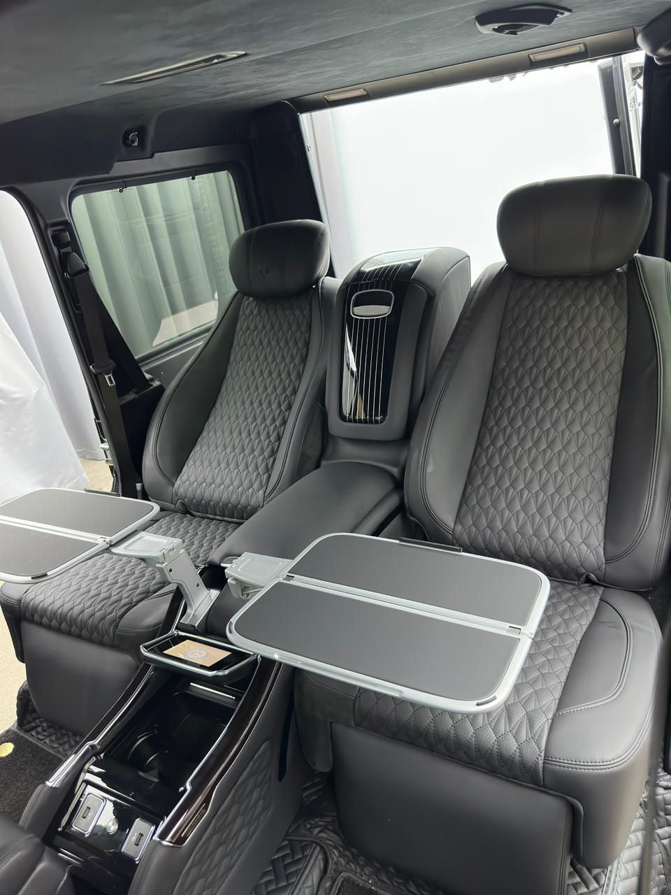 Rear seats with central multifunctional panel for Mercedes-Benz W463A and W465, customizable options and colors by Custom Class.