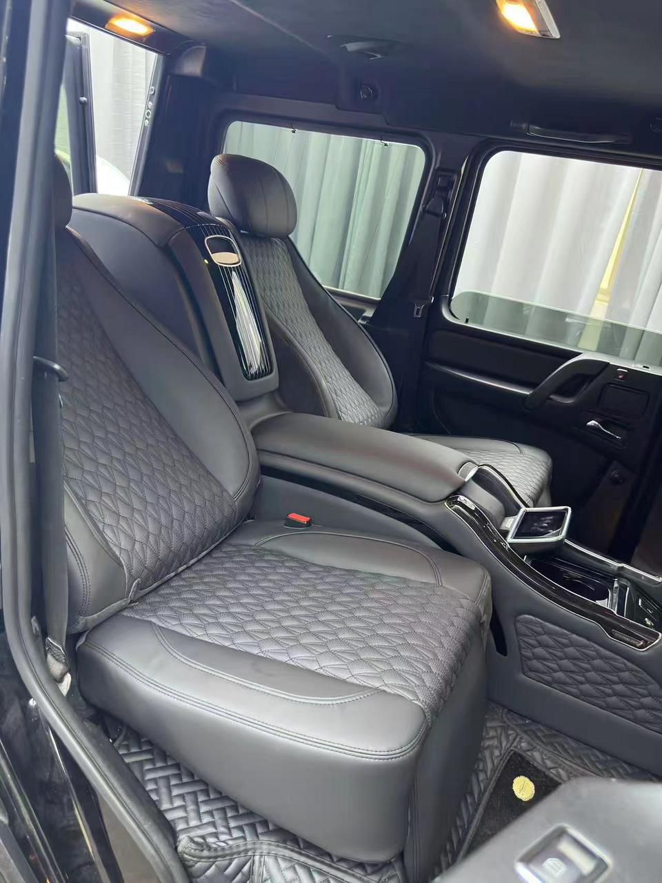 Rear seats with central multifunctional panel for Mercedes-Benz W463A and W465, customizable options and colors by Custom Class.