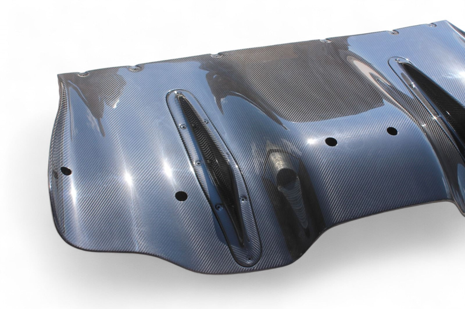 Rear bumper carbon diffuser for Ferrari 458 2009-2015 from Custom Class, crafted from genuine carbon fiber with a high-gloss UV protective varnish.