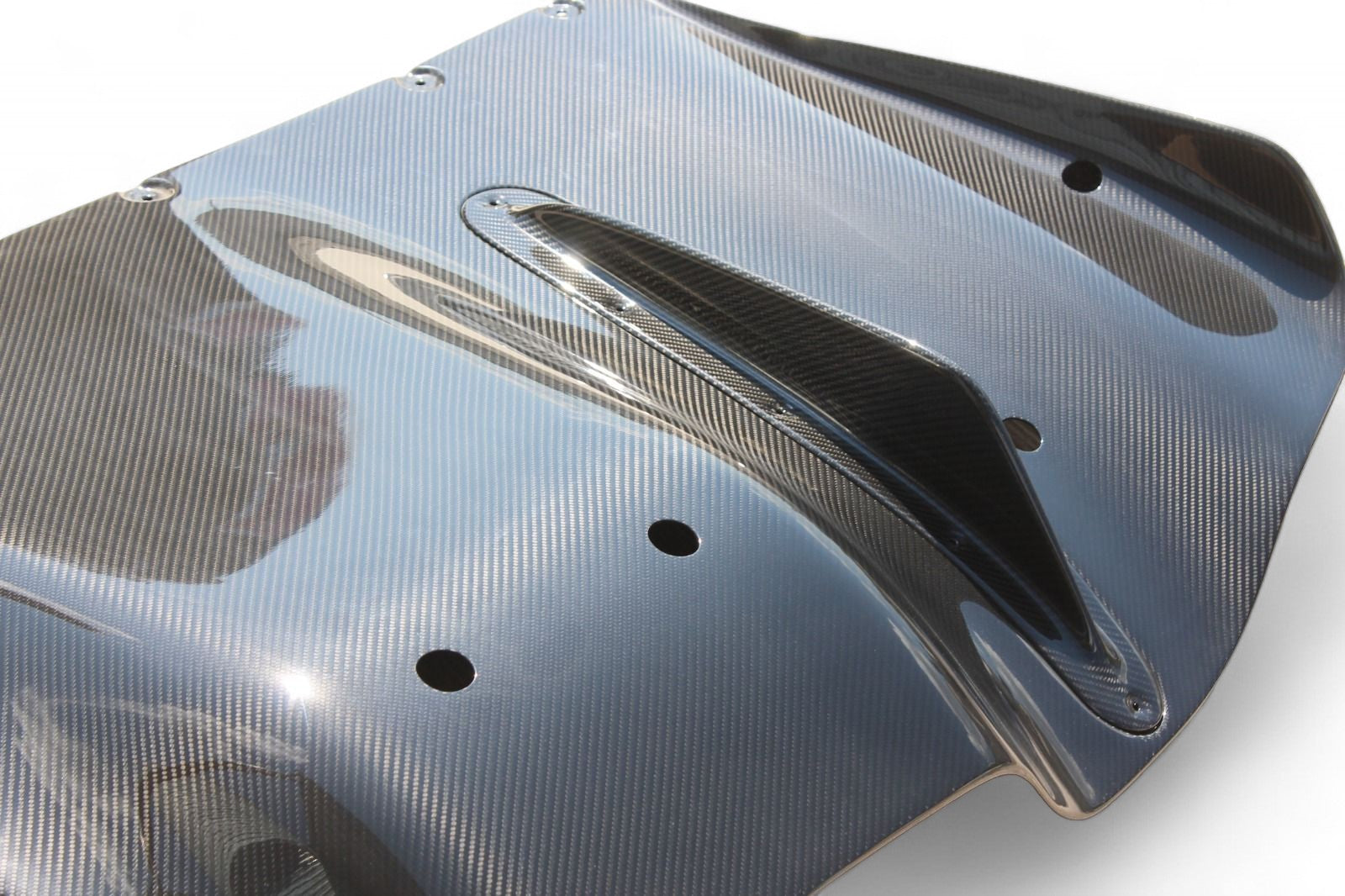 Rear bumper carbon diffuser for Ferrari 458 2009-2015 from Custom Class, crafted from genuine carbon fiber with a high-gloss UV protective varnish.