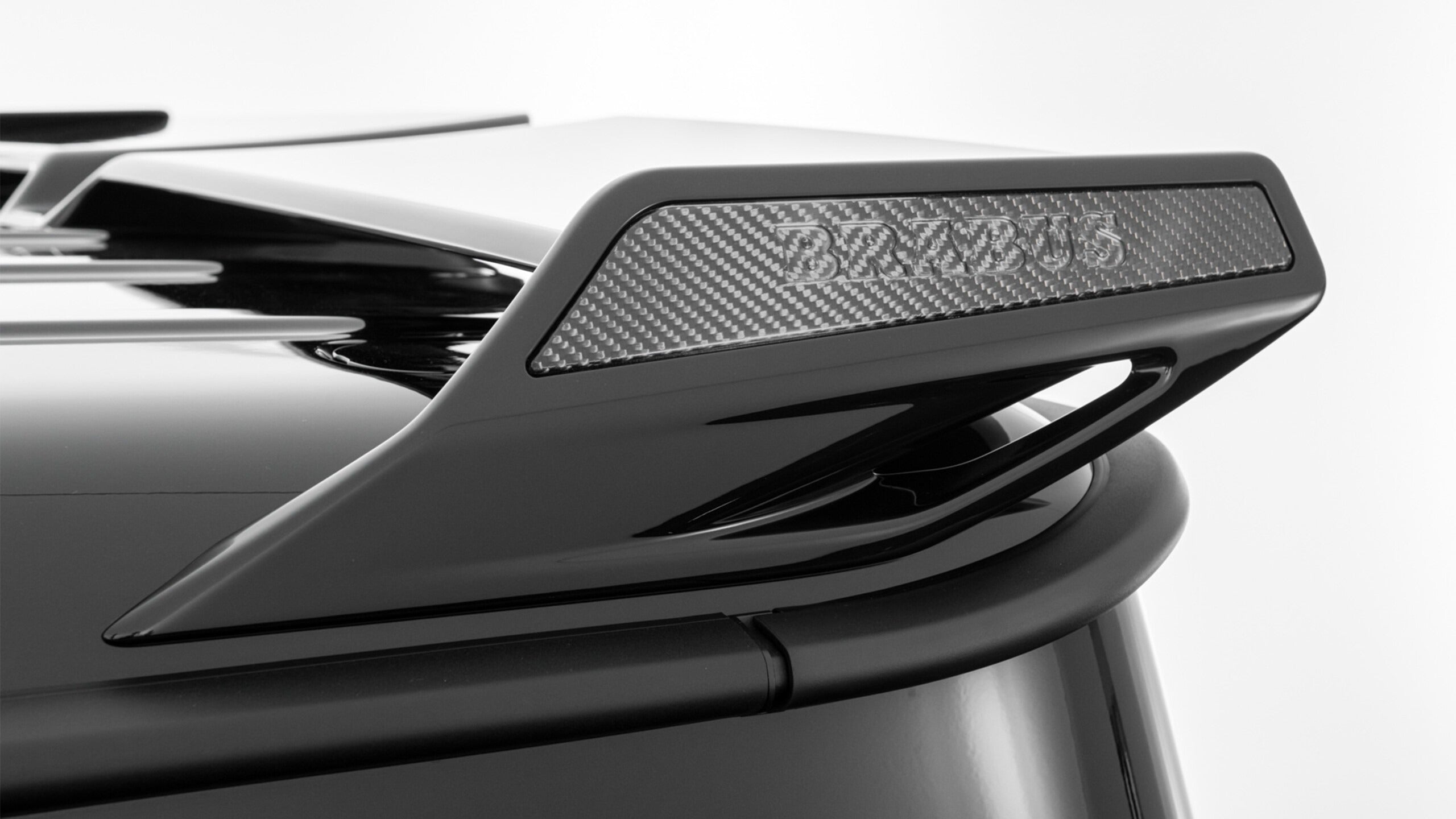 Brabus Rear Roof Spoiler with Carbon Inserts for Mercedes-Benz G-Class W465 (2024+), high-quality fiberglass with carbon accents.