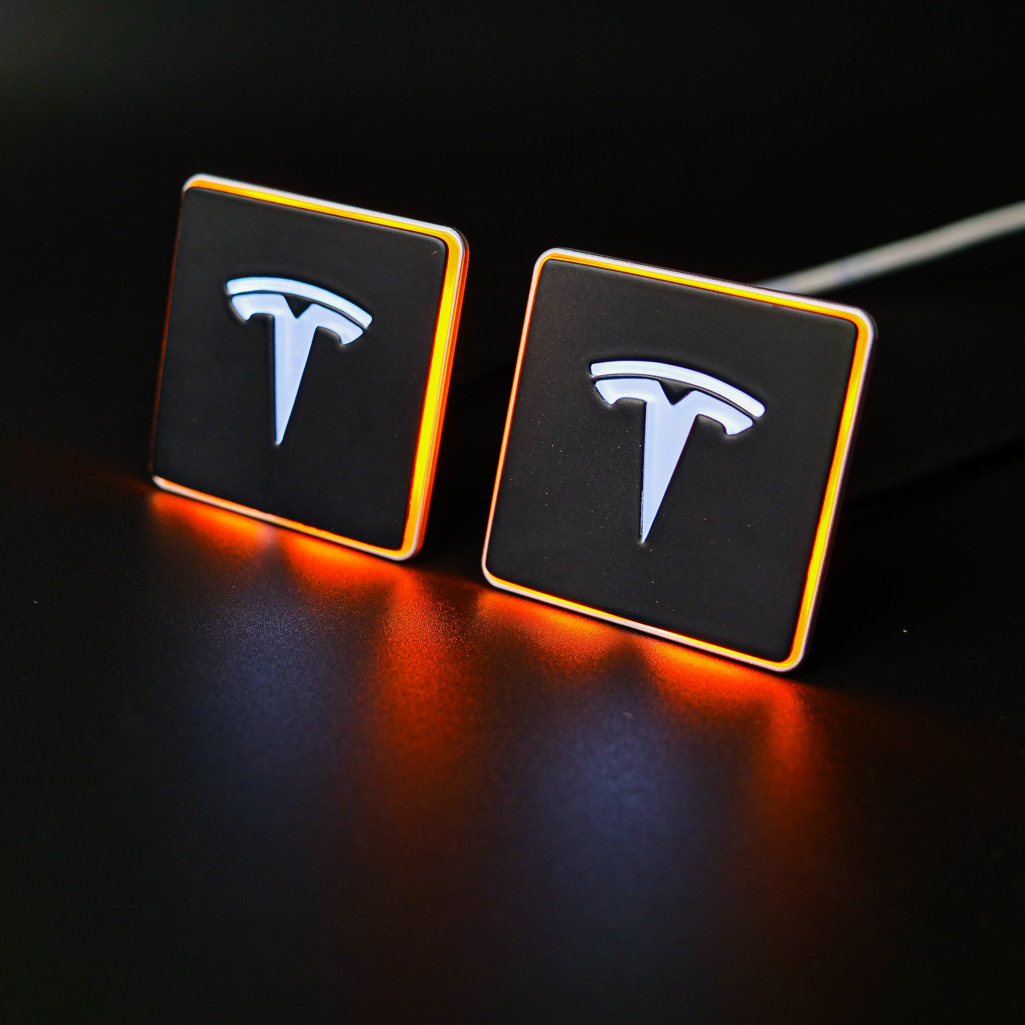 LED-illuminated seat emblems for Tesla Model S, Model 3, Model X, Model Y, and Cybertruck, available in customizable LED colors for front and rear seats.