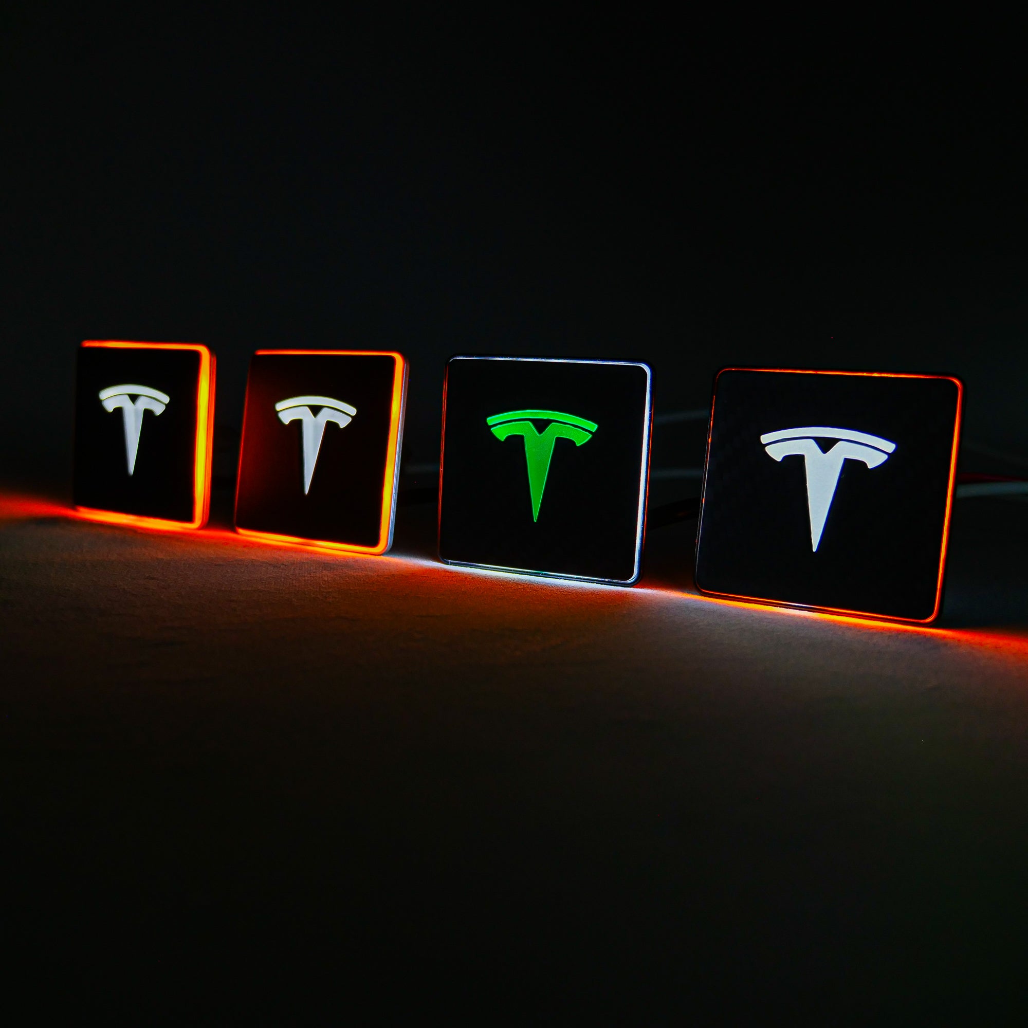 LED-illuminated seat emblems for Tesla Model S, Model 3, Model X, Model Y, and Cybertruck, available in customizable LED colors for front and rear seats.