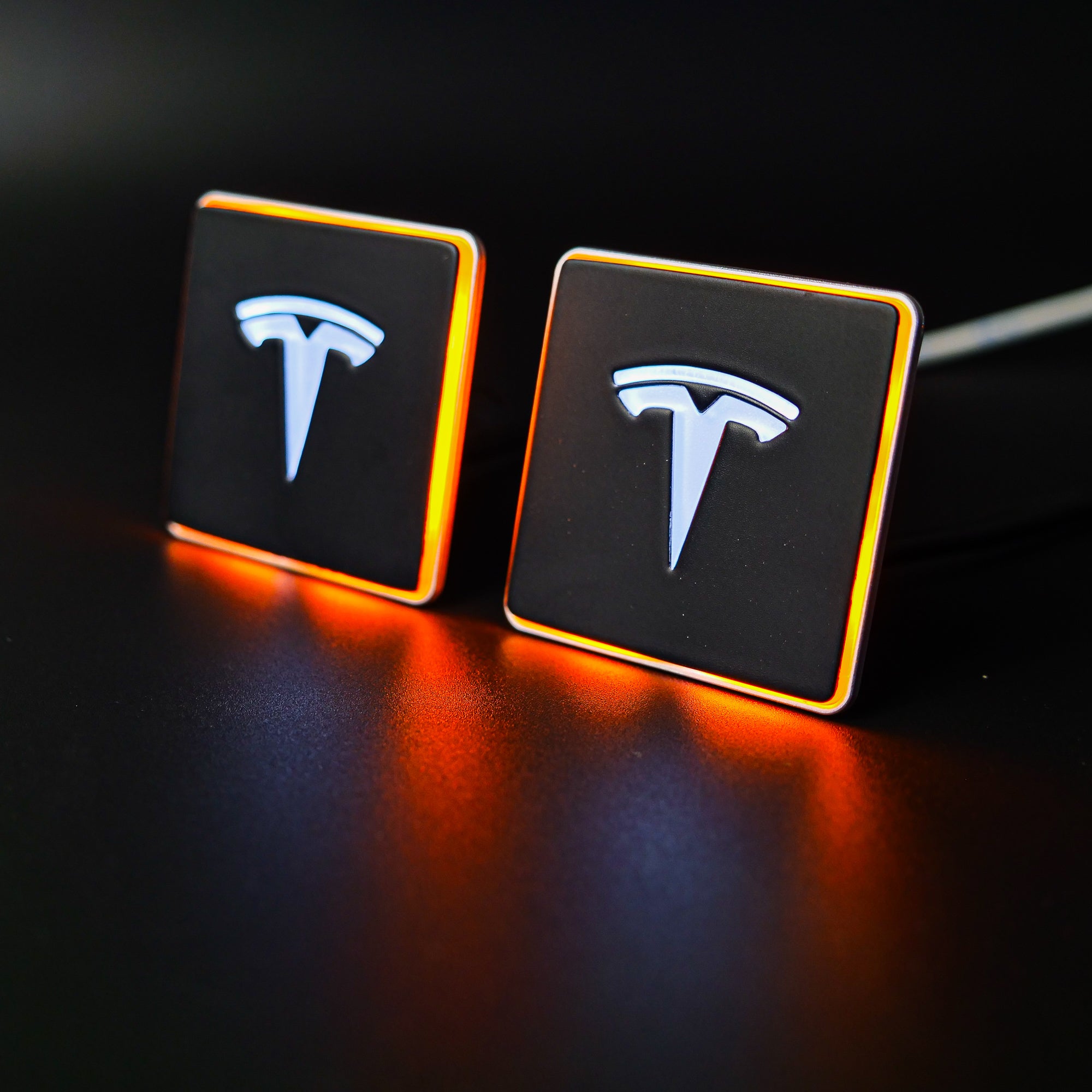 LED-illuminated seat emblems for Tesla Model S, Model 3, Model X, Model Y, and Cybertruck, available in customizable LED colors for front and rear seats.