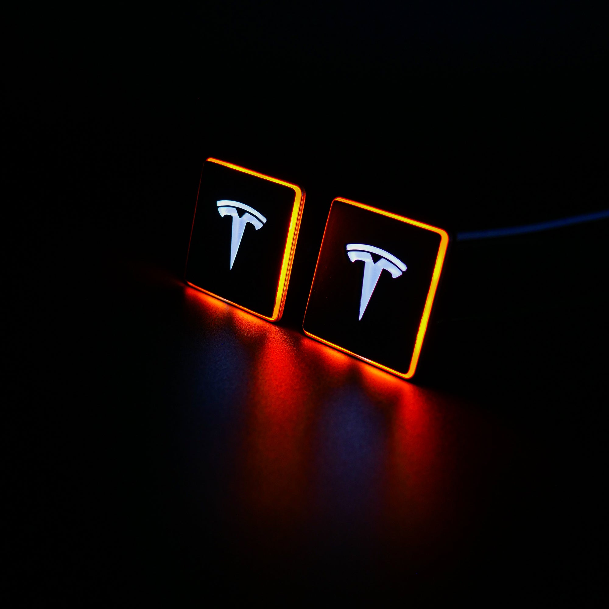 LED-illuminated seat emblems for Tesla Model S, Model 3, Model X, Model Y, and Cybertruck, available in customizable LED colors for front and rear seats.