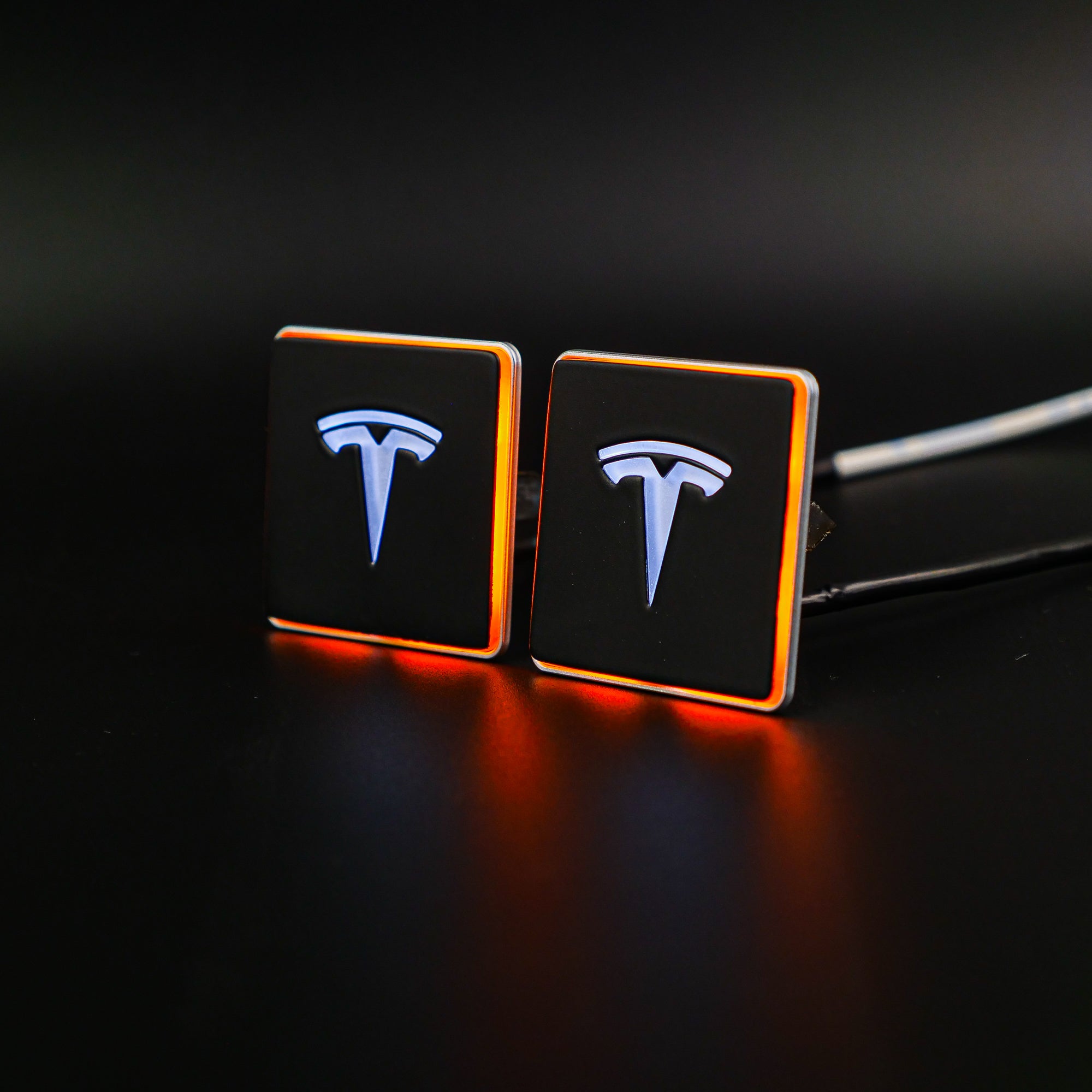 LED-illuminated seat emblems for Tesla Model S, Model 3, Model X, Model Y, and Cybertruck, available in customizable LED colors for front and rear seats.