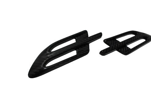 Side vents covers 2-piece set for Bentley Bentayga 2015-2018, made from genuine carbon fiber with a grey high-gloss finish.