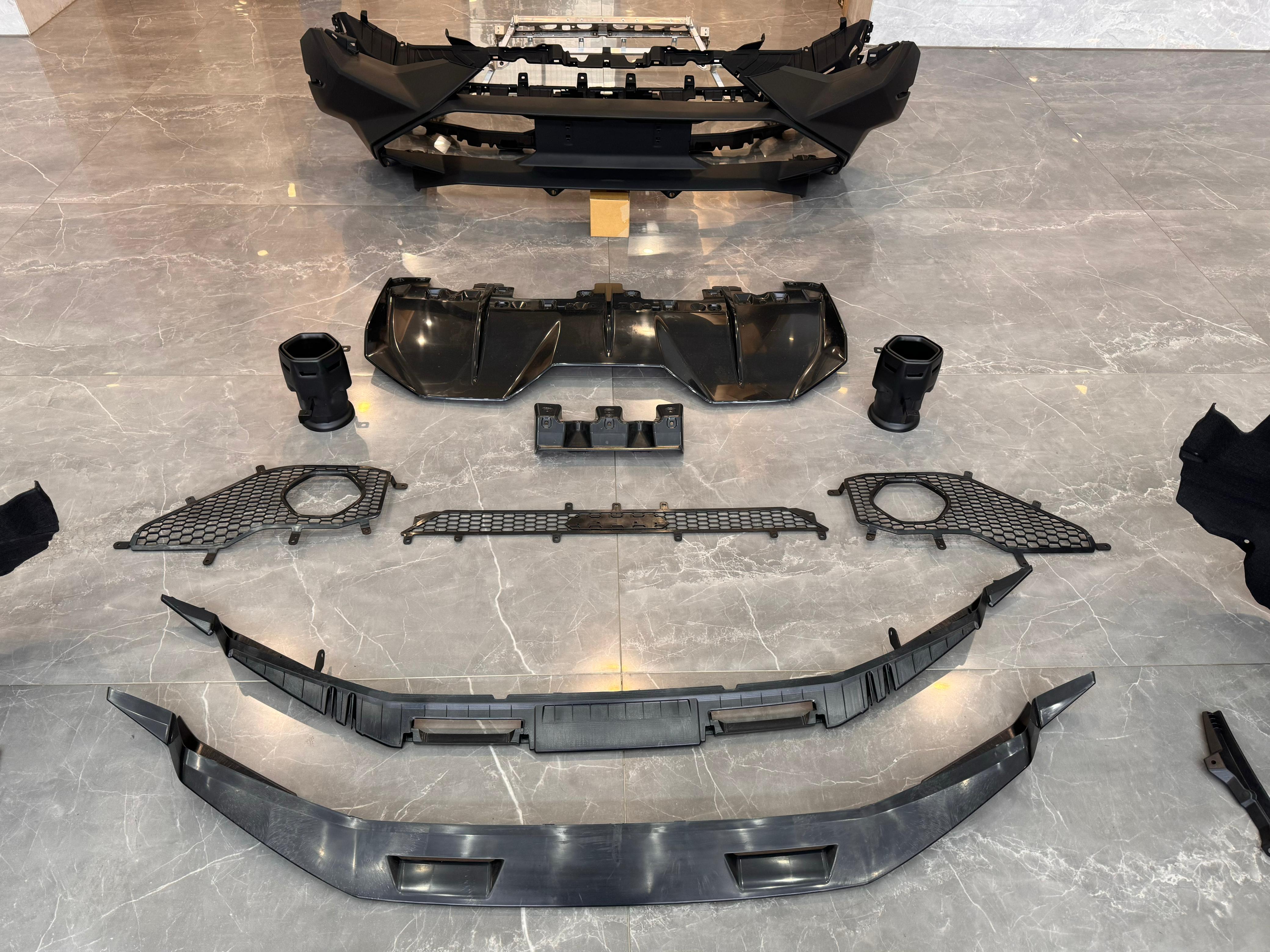 Tecnica style body kit for Lamborghini Huracan 2014+, featuring front and rear bumpers, fenders, spoiler, headlamps, and hood from Custom Class.