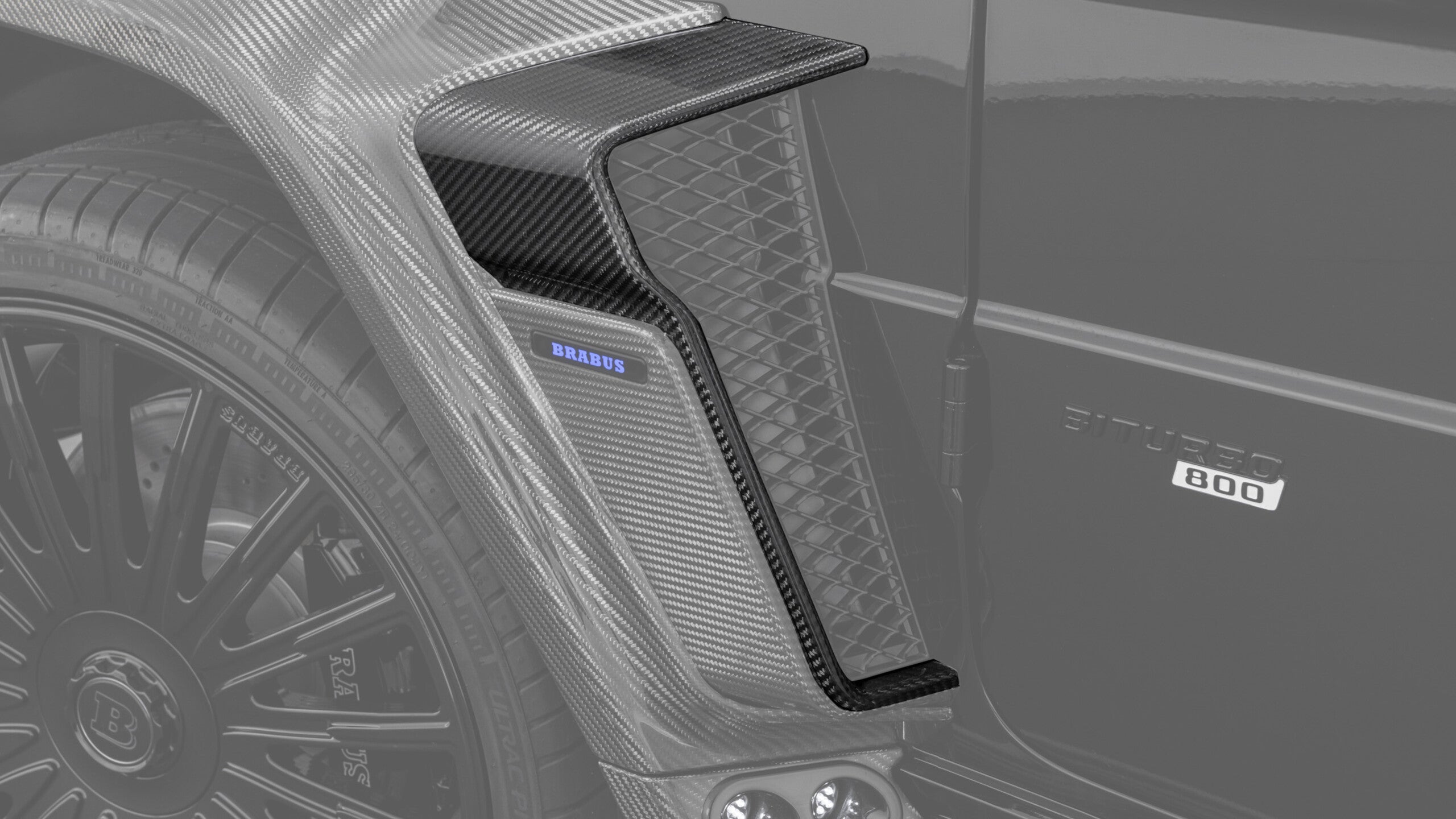 Widestar Carbon Package III for Mercedes-Benz G-Class W465 2024+ from Custom Class, featuring front and rear trim frames in high-gloss carbon fiber.