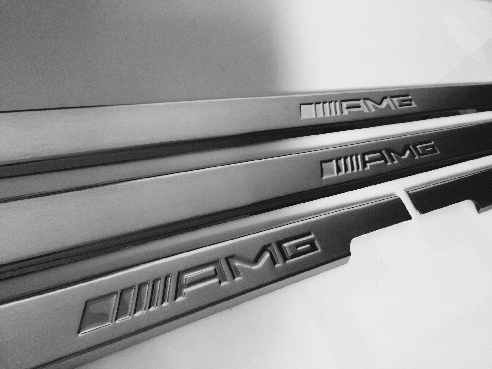 AMG Door Sills 4 or 5 pcs for Mercedes-Benz G-Class W463 from Custom Class, crafted from stainless steel with a sleek design.