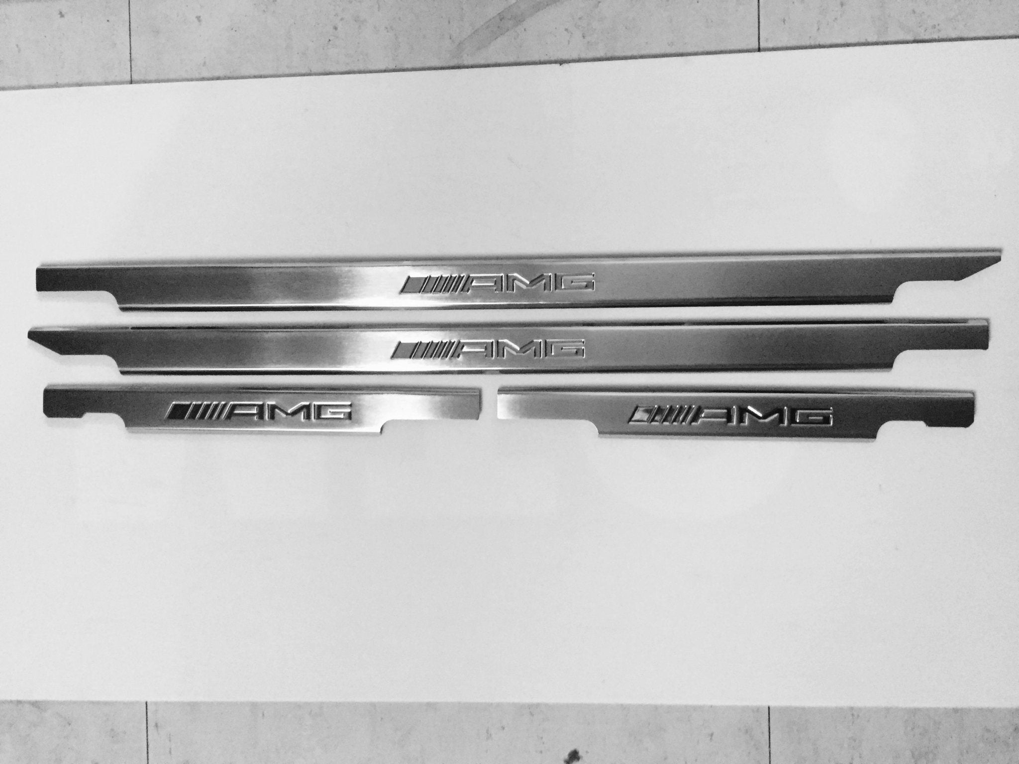 AMG Door Sills 4 or 5 pcs for Mercedes-Benz G-Class W463 from Custom Class, crafted from stainless steel with a sleek design.