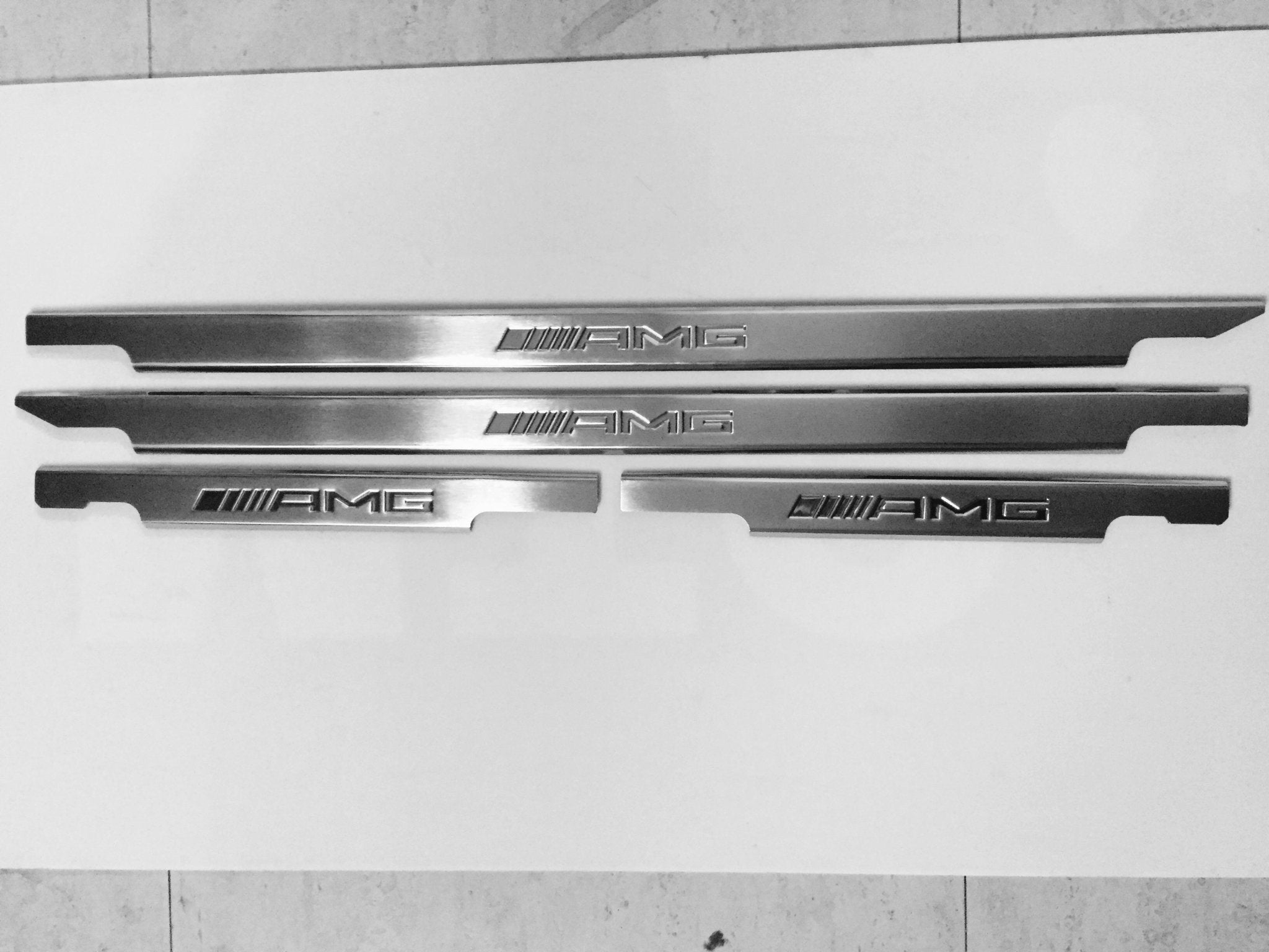 AMG Door Sills 4 or 5 pcs for Mercedes-Benz G-Class W463 from Custom Class, crafted from stainless steel with a sleek design.