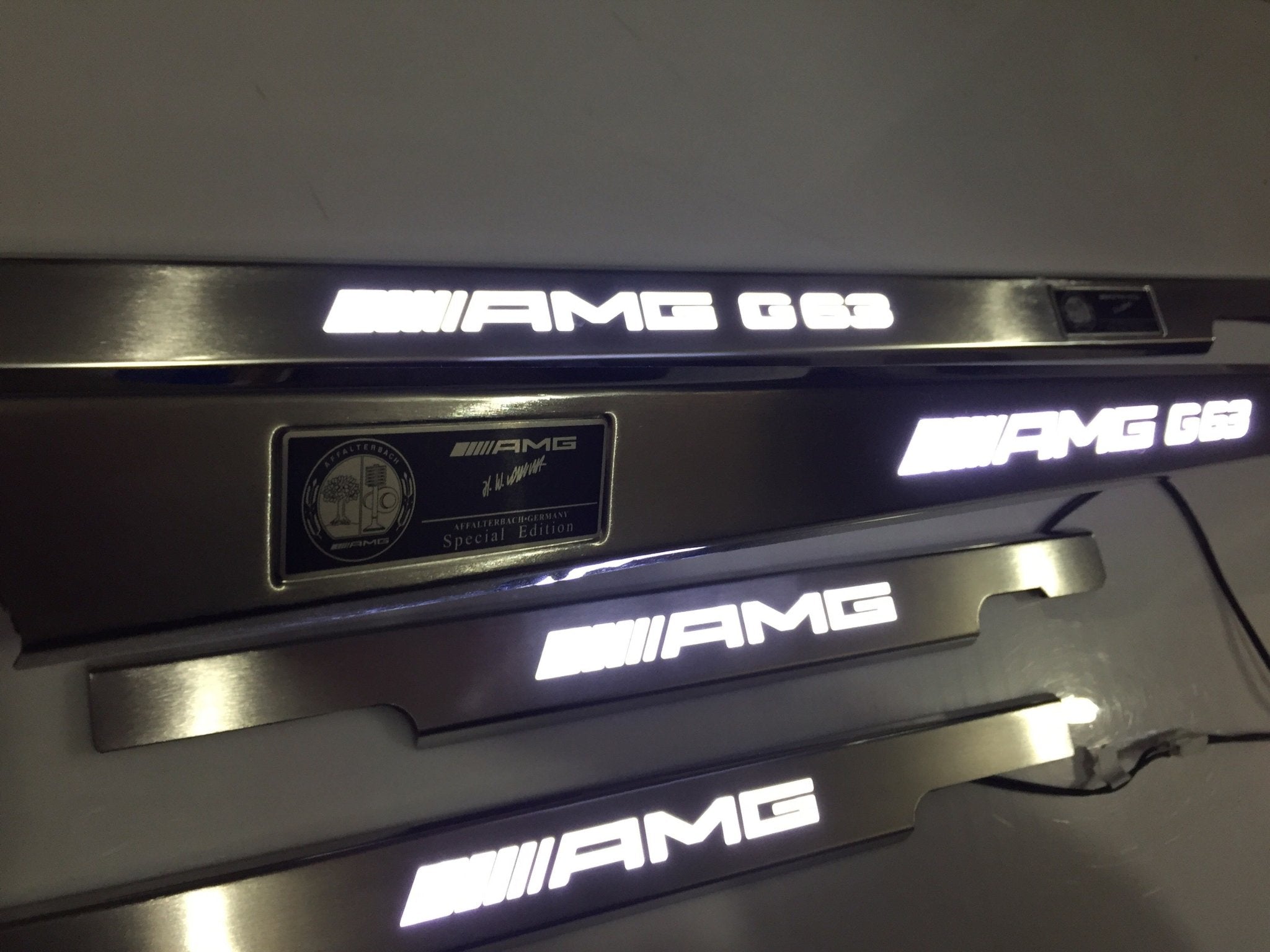 AMG G63 LED Illuminated Door Sills 4 or 5 pcs for Mercedes-Benz G-Class W463 from Custom Class, crafted from stainless steel with LED illumination.