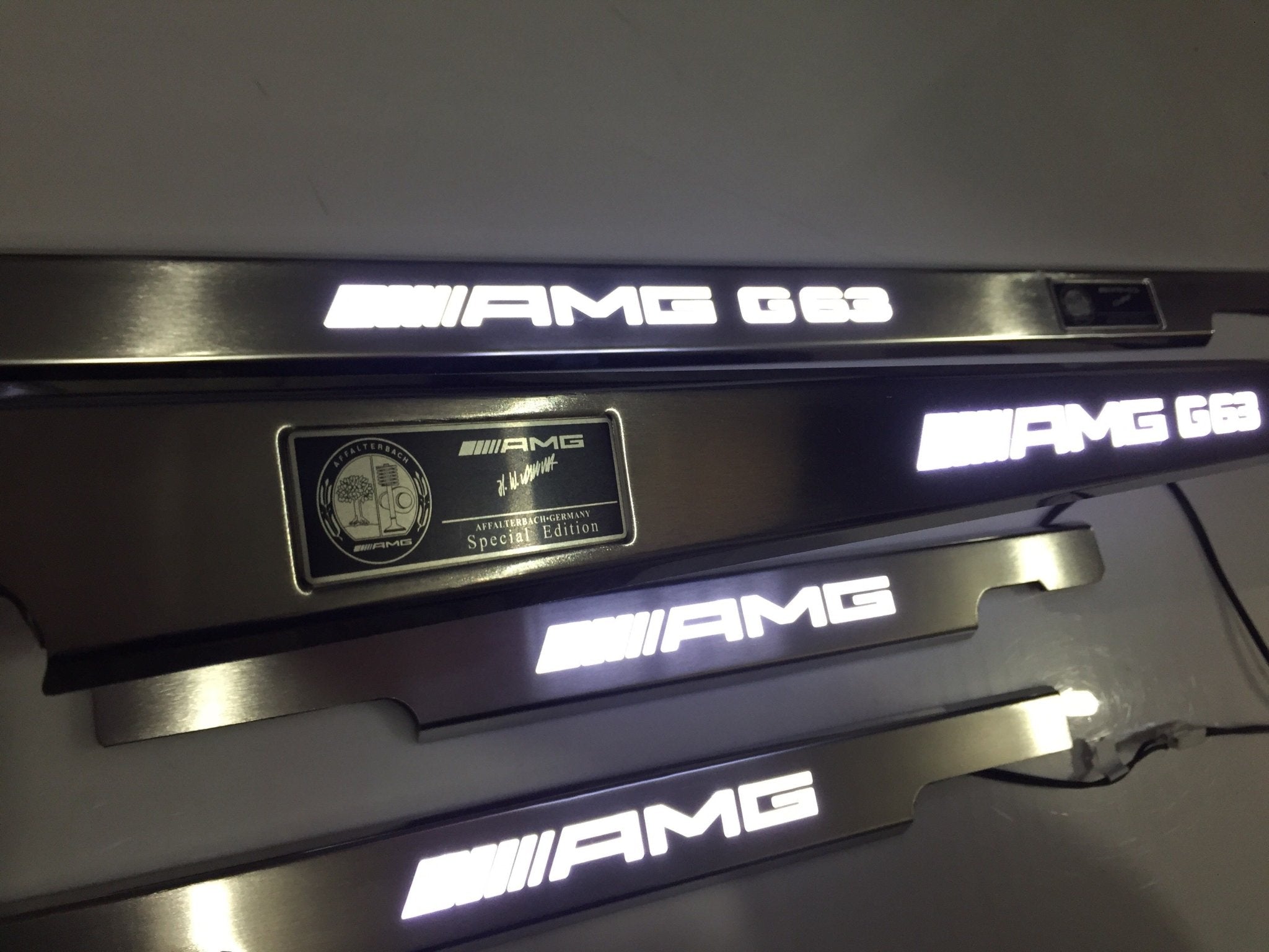 AMG G63 LED Illuminated Door Sills 4 or 5 pcs for Mercedes-Benz G-Class W463 from Custom Class, crafted from stainless steel with LED illumination.