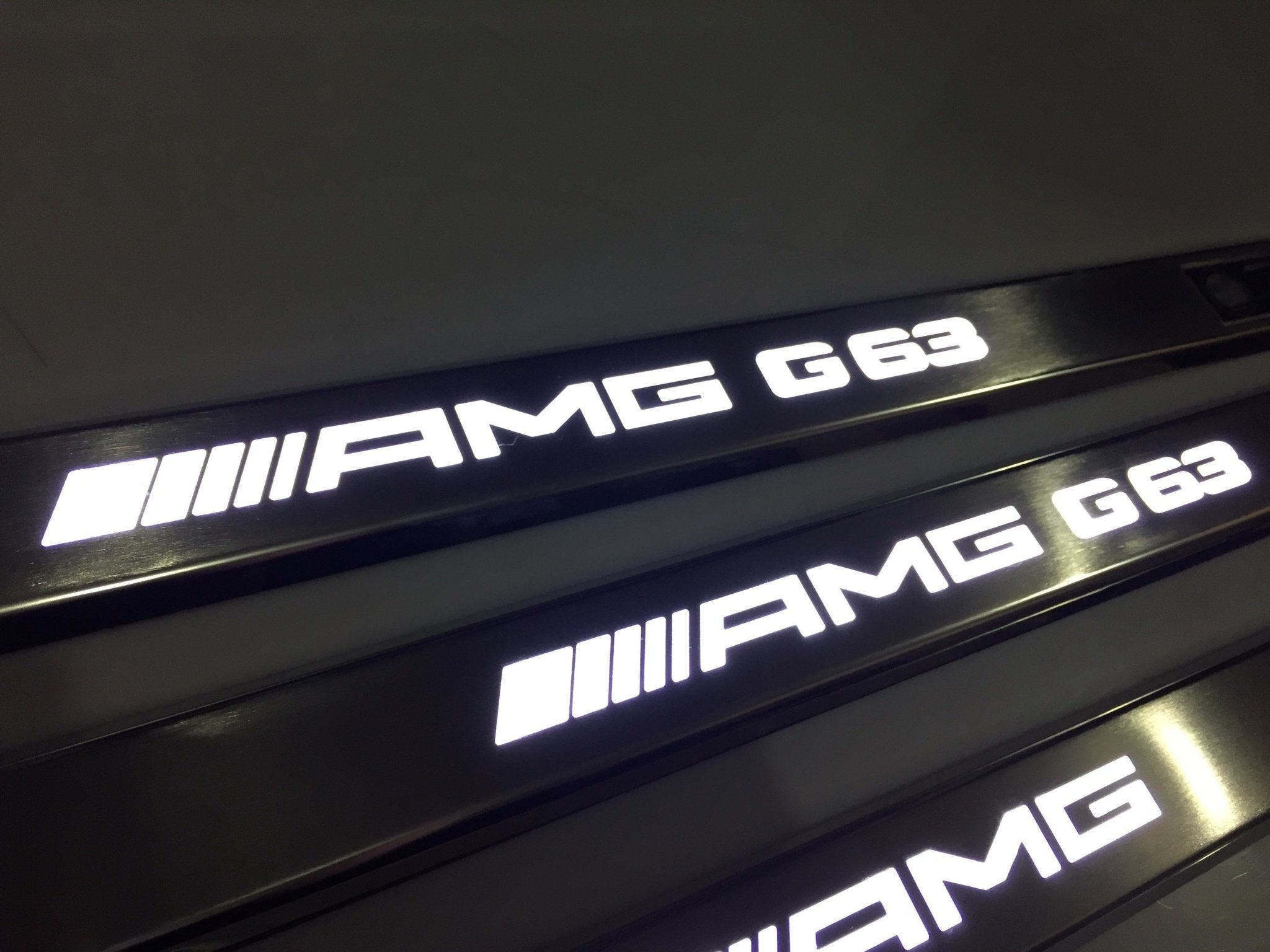 AMG G63 LED Illuminated Door Sills 4 or 5 pcs for Mercedes-Benz G-Class W463 from Custom Class, crafted from stainless steel with LED illumination.