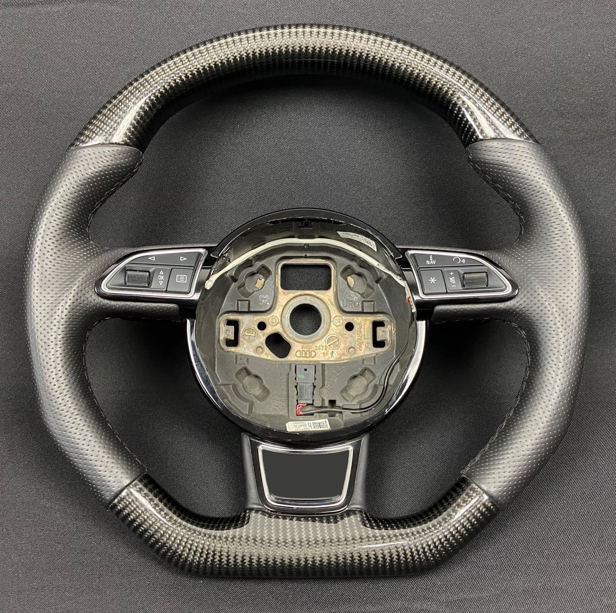 OEM remanufactured Audi A6 A7 A8 steering wheel with carbon fiber, perforated black leather, flat bottom, and stock paddle shifts from Custom Class.