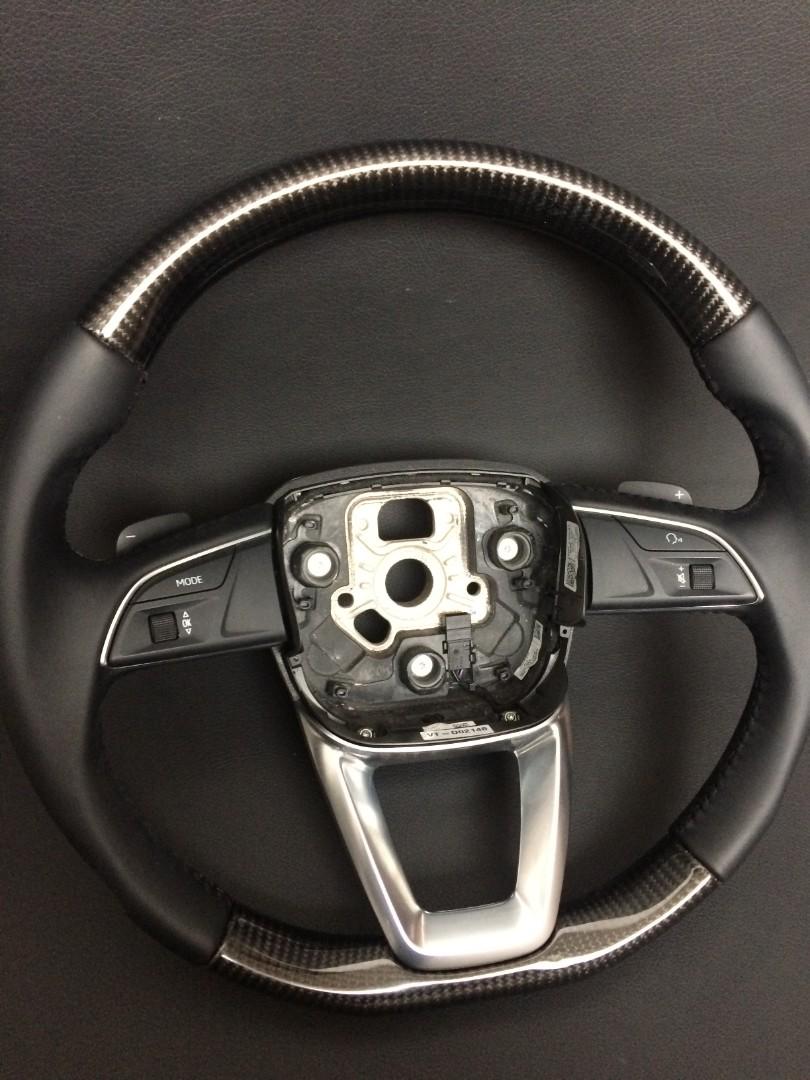 OEM remanufactured Audi Q7 steering wheel with carbon fiber, black leather, flat bottom, and stock paddle shifts from Custom Class.