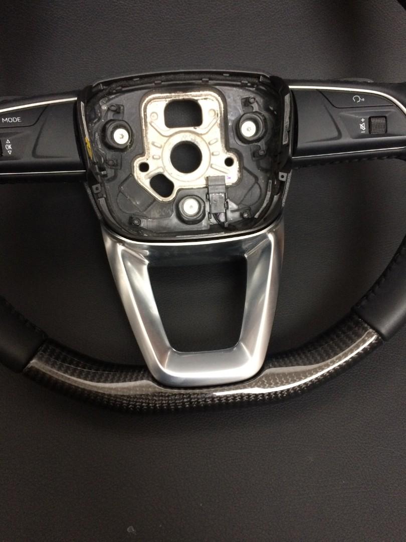 OEM remanufactured Audi Q7 steering wheel with carbon fiber, black leather, flat bottom, and stock paddle shifts from Custom Class.