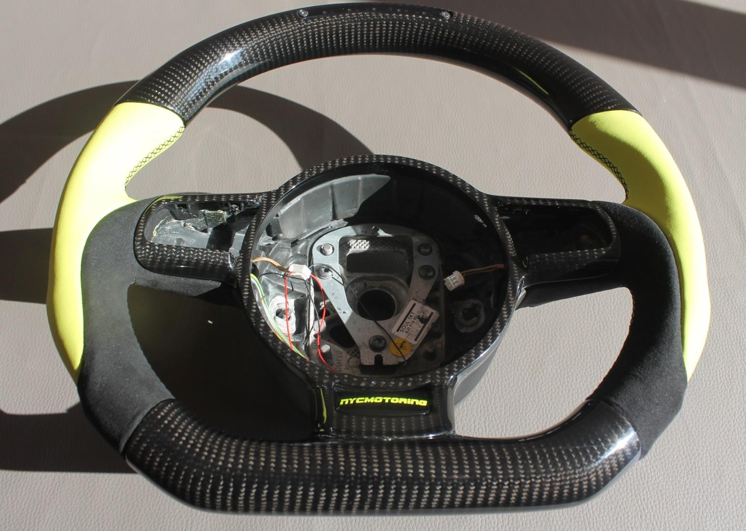 OEM remanufactured Audi R8 steering wheel with carbon fiber, yellow leather, alcantara, flat bottom, and LED panel from Custom Class.