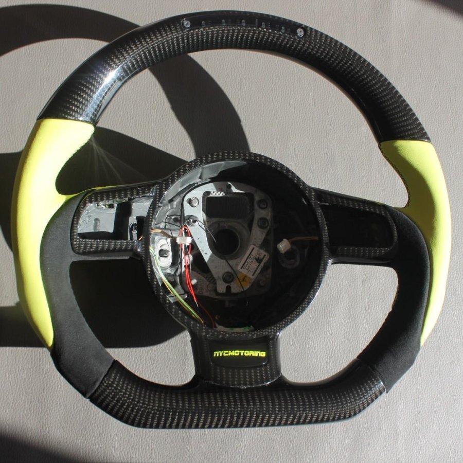 OEM remanufactured Audi R8 steering wheel with carbon fiber, yellow leather, alcantara, flat bottom, and LED panel from Custom Class.