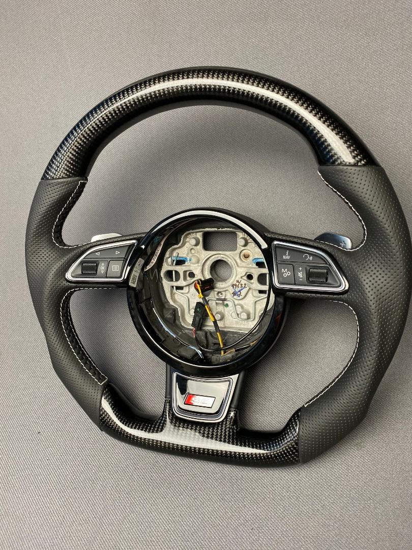 OEM remanufactured Audi S8 steering wheel with carbon fiber, perforated black leather, flat bottom, and piano black center from Custom Class.