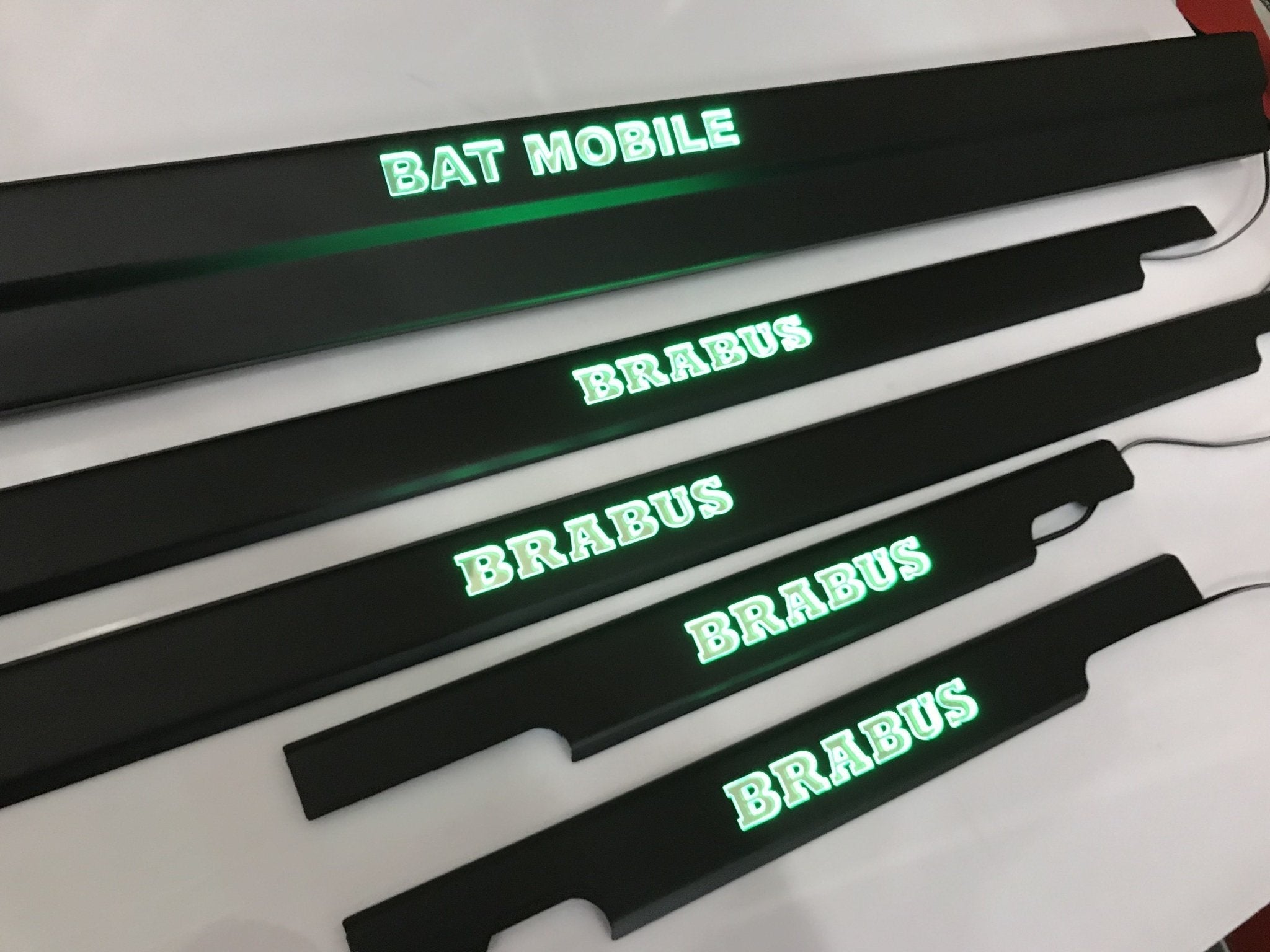 Bat Mobile Brabus style LED illuminated door sills, 4 or 5 pcs, for Mercedes-Benz G-Class W463 from Custom Class, featuring stainless steel construction and blue or orange sign colors.