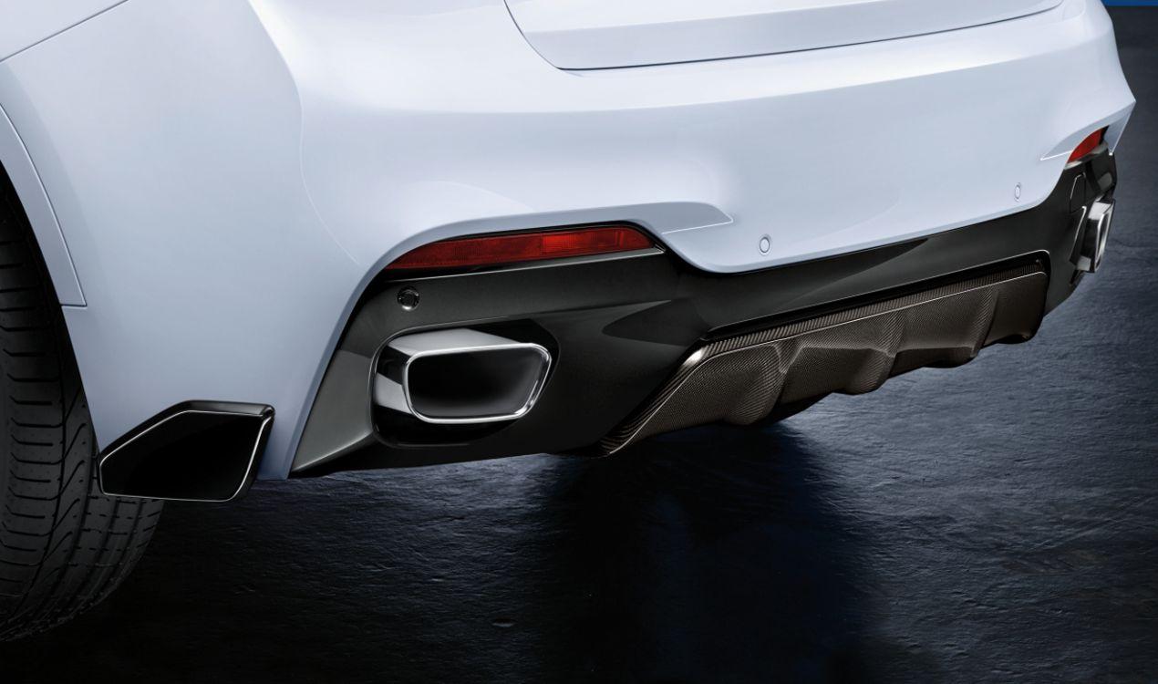 Fiberglass side fangs for rear bumper BMW X5 F15 from Custom Class, designed for a sporty and aggressive rear-end appearance.