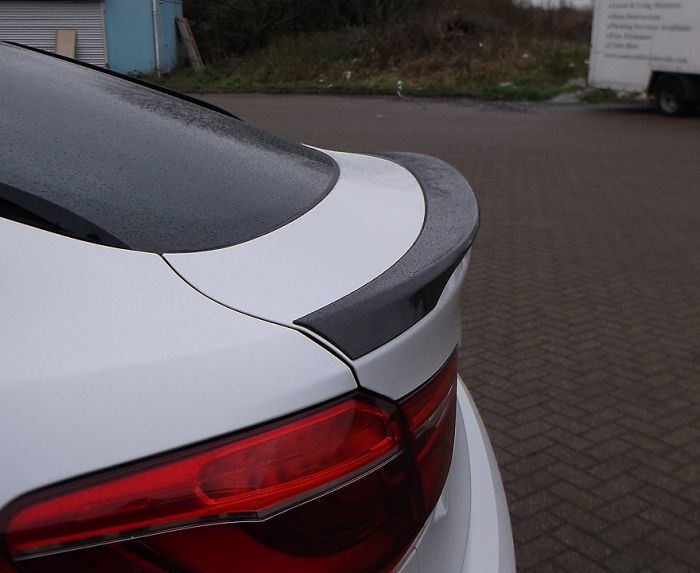 Fiberglass rear spoiler for BMW X6 F16 from Custom Class, designed for sporty styling and improved aerodynamics.